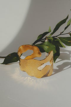 Imperfection Bracelet is handcrafted from gold-plated bronze