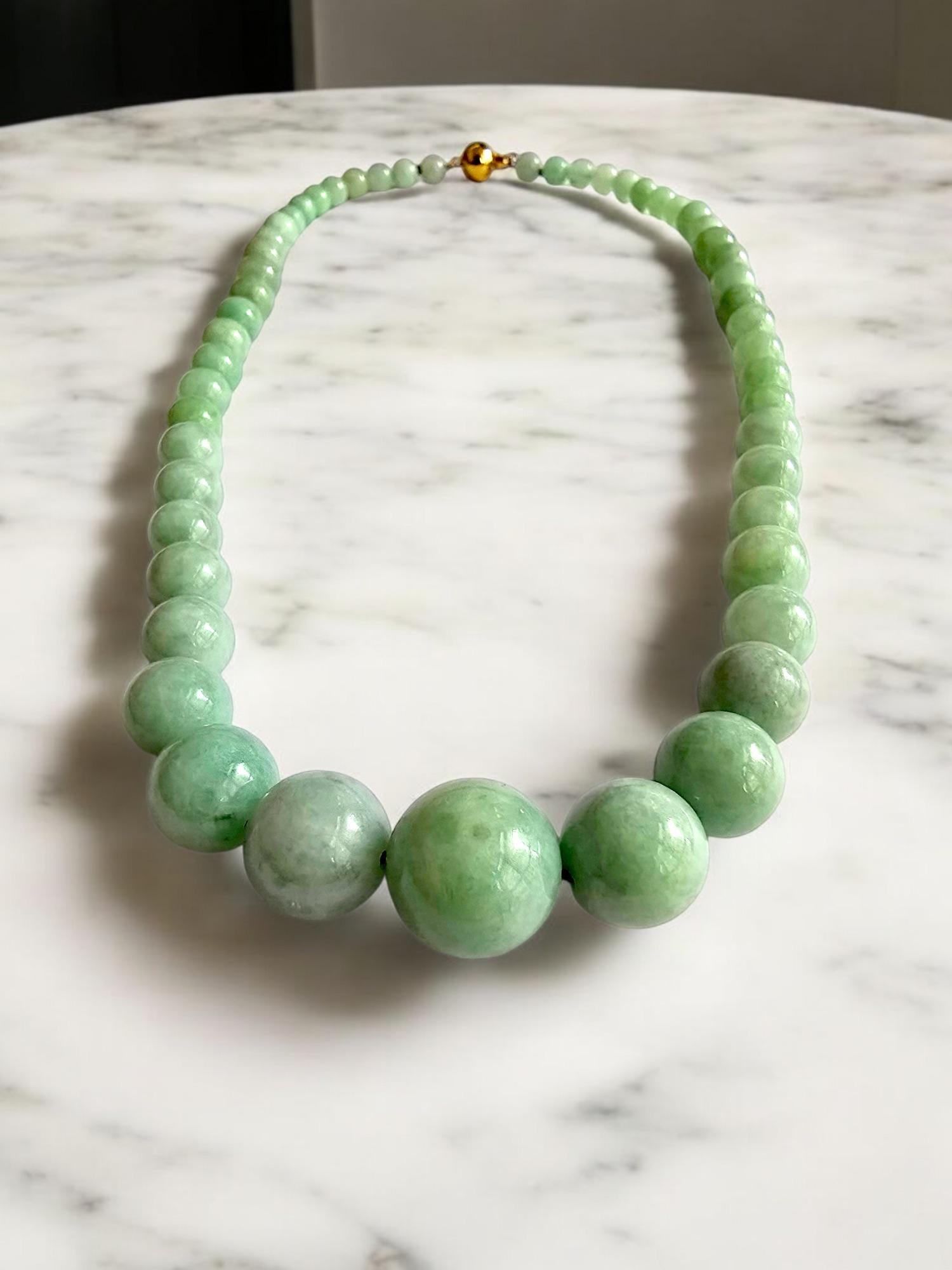 15mm to 6mm Gradient Beads Necklace; perfectly calibrated Green Burmese Jadeite Beads Necklace with solid 14K Yellow Gold. This unique beads Necklace is 100% cut, calibrated, strung, and Made in Hong Kong. Some of the rarest naturally occurring hues