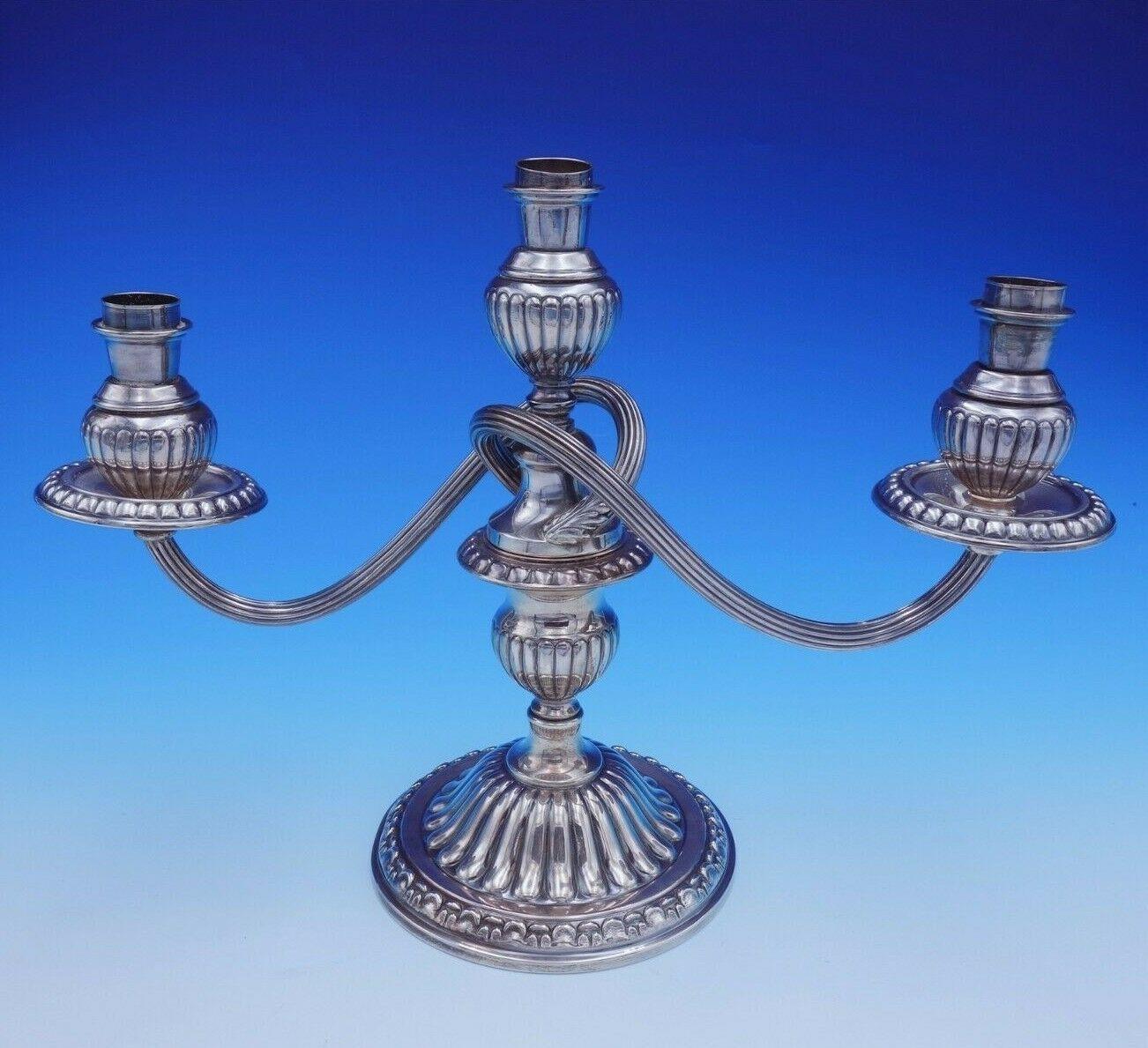 Imperial by Camusso

Beautiful imperial by Camusso sterling silver pair of 3-light candelabras with a lovely scalloped design. The pieces measure 9 3/4