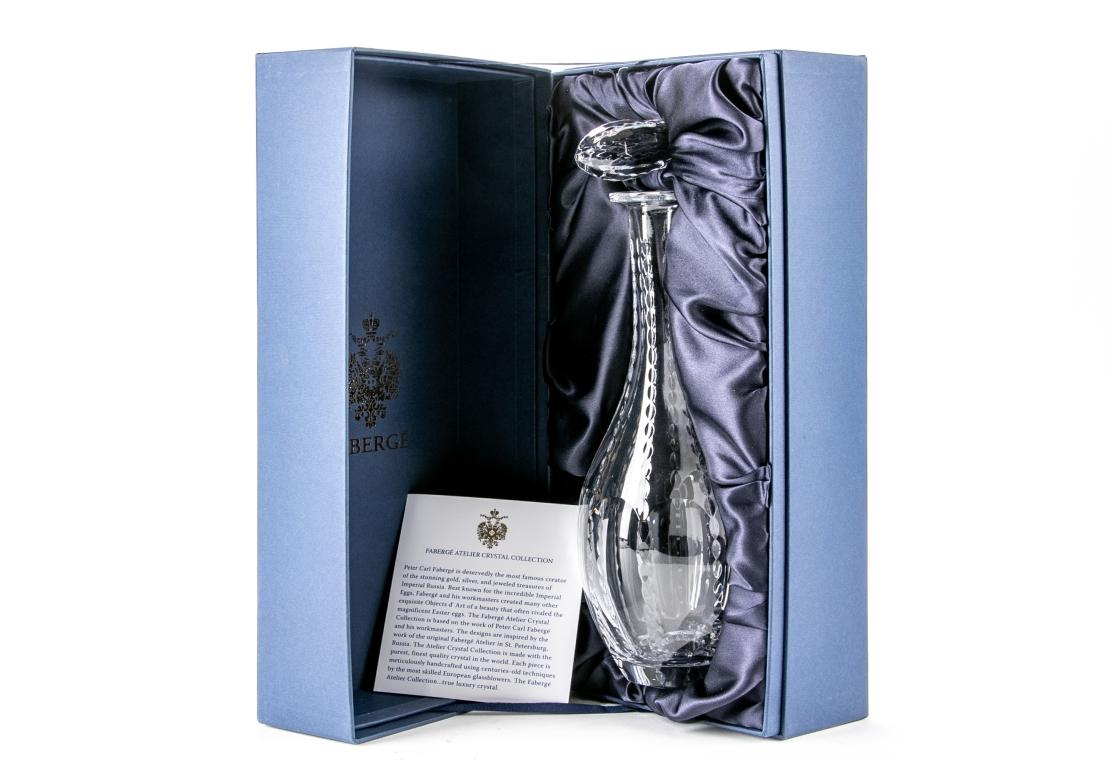 Imperial Collection of Faberge Bristol wine decanter, style -#540-68, cut crystal, narrow neck ending in a bulbous body, oblong stopper, etched manufacturer's mark on collar.

Dimensions: 14 1/2