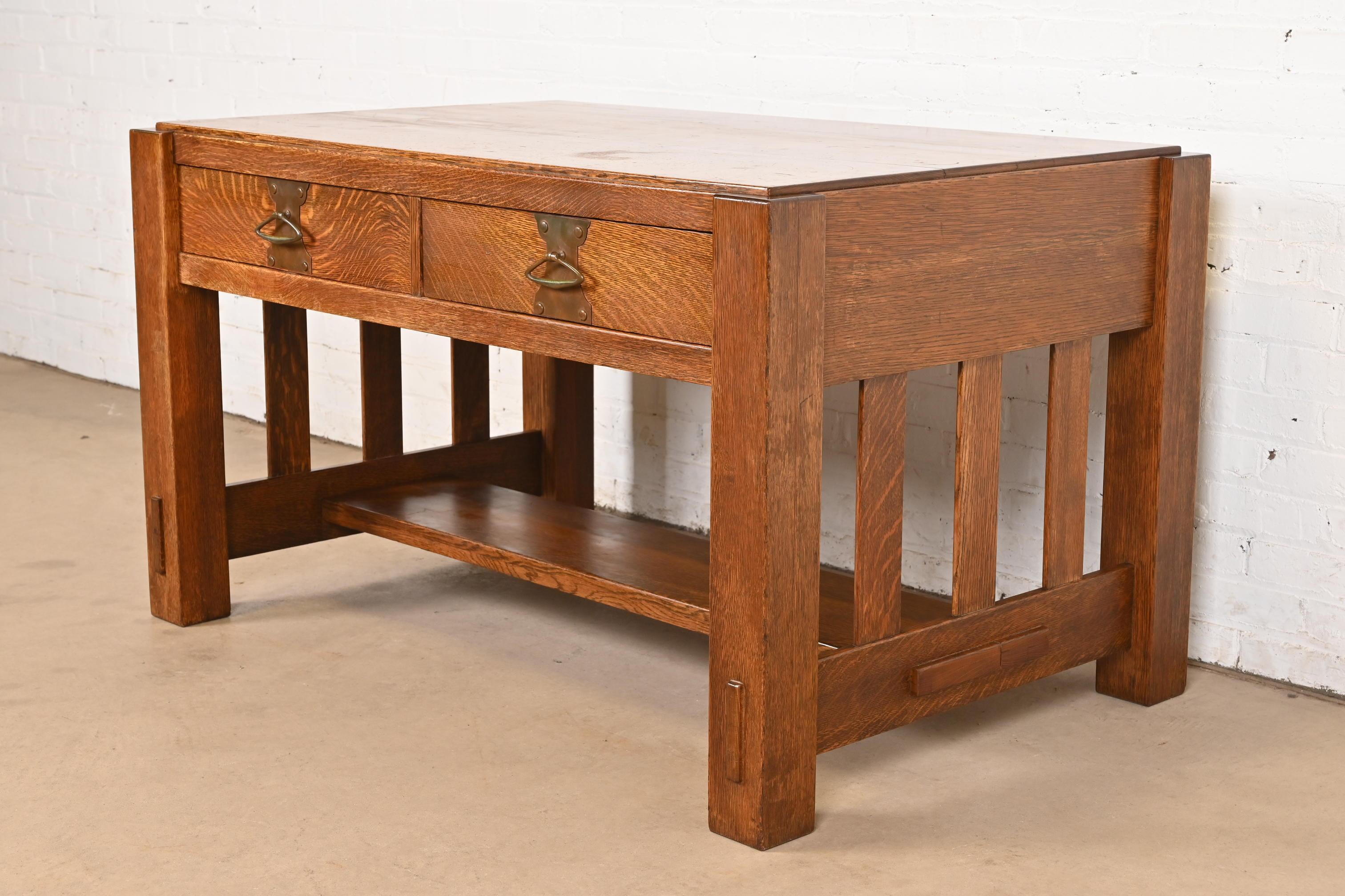 An exceptional antique Mission or Arts & Crafts writing desk or library table

In the manner of Stickley Brothers 

By Imperial Furniture Co.

USA, Circa 1910

Solid quarter sawn oak, with original copper hardware.

Measures: 50.25