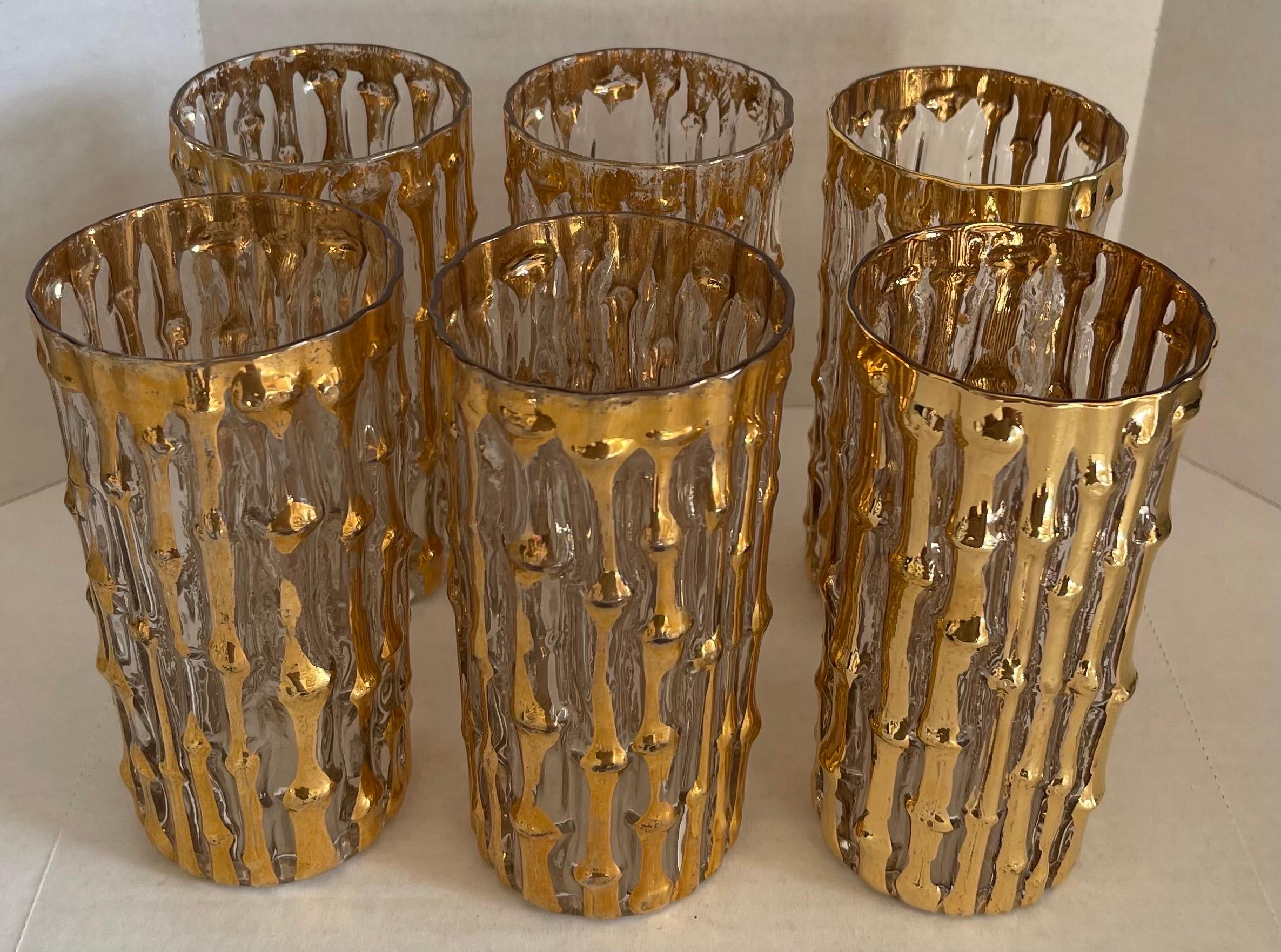 Set of six 1960s imperial glass 'Bambu' collection gold highball glasses. Overall raised bamboo design with 22-karat gold. Each glass stamped with IG imperial glass mark on the bottom.