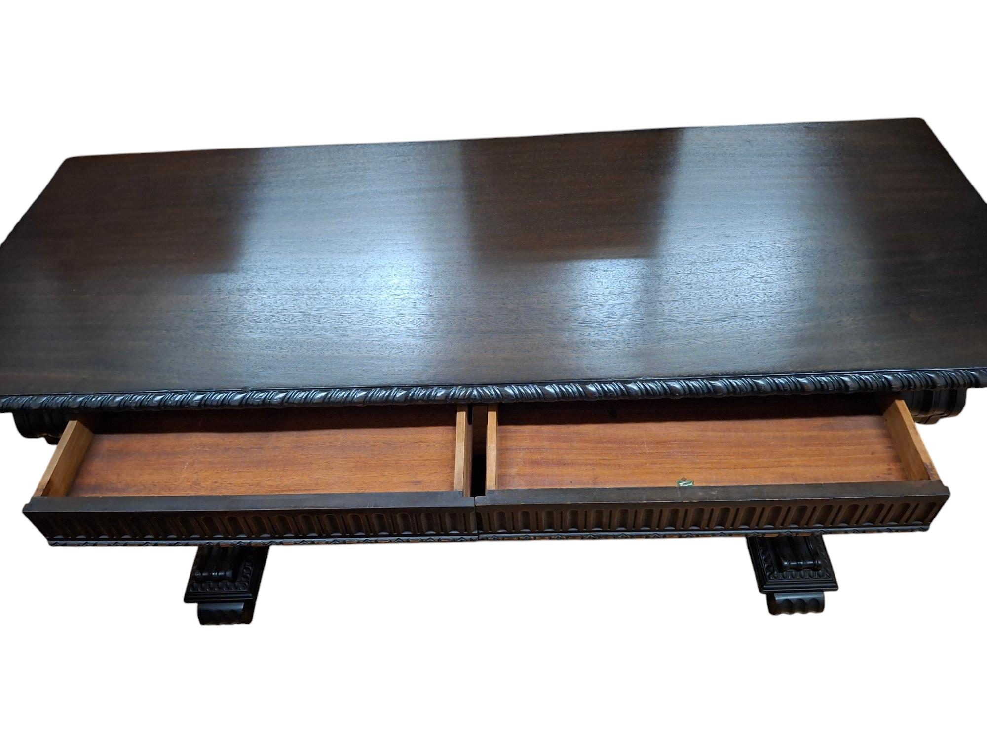 Beautiful Tudor design mahogany console table by Imperial Grand Rapids furniture company.  Top has been beautifully refinished.  Two dovetail drawers. 

60