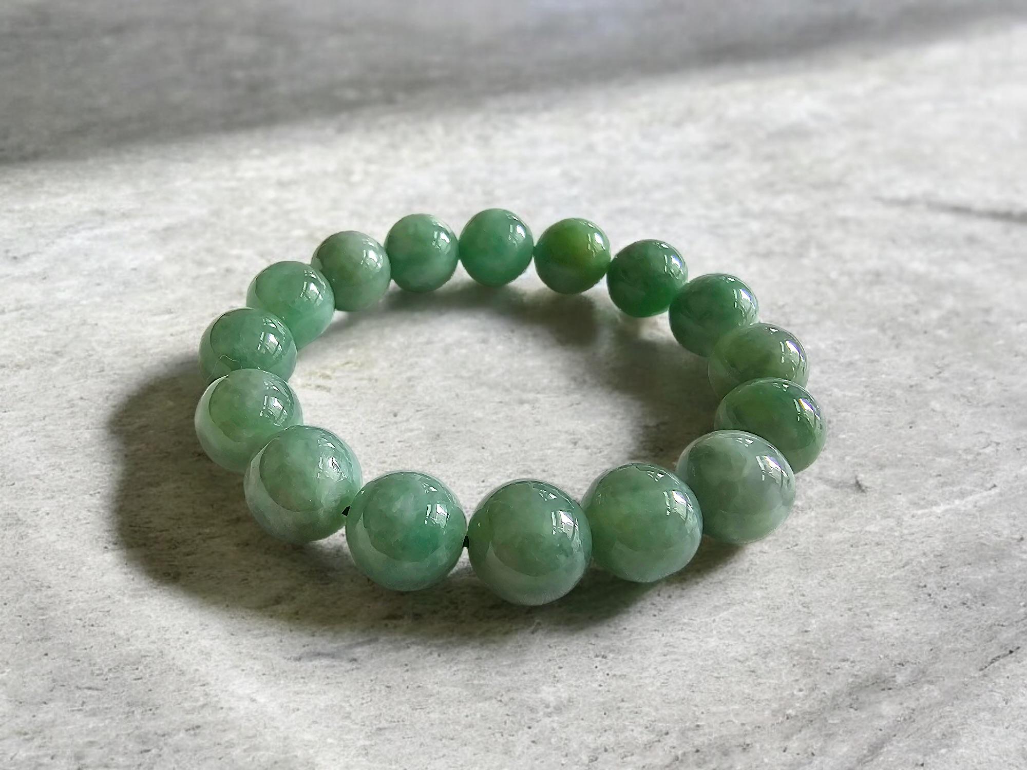 Imperial Japanese Green and Lavender Burmese A-Jade Jadeite Beaded Bracelet (MADE IN JAPAN) (12mm Each x 16 beads) 05017 with calibrated ball beads.

12mm each, 16 perfectly calibrated Green Burmese Jadeite Ball Beads. This unique beads bracelet is