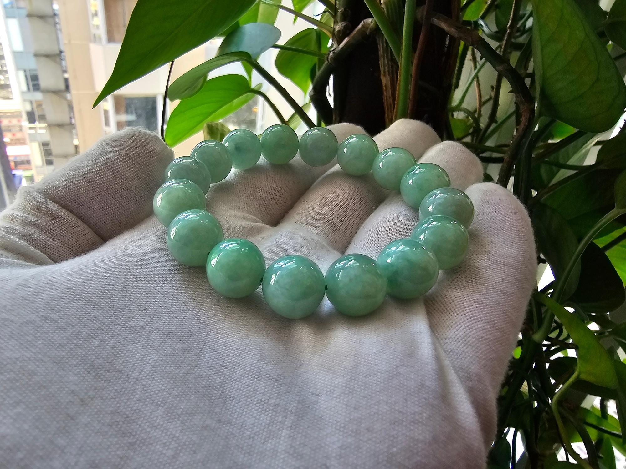 Imperial Japanese Green  Burmese A-Jade Jadeite Beaded Bracelet (MADE IN JAPAN) (12mm Each x 16 beads) 05019 
with calibrated ball beads.

12mm each, 16 perfectly calibrated Green Burmese Jadeite Ball Beads. This unique beads bracelet is 100% cut,