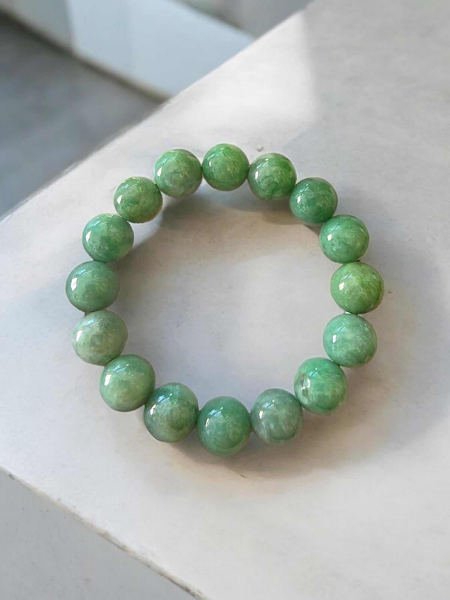 Imperial Japanese Green  Burmese A-Jade Jadeite Beaded Bracelet (MADE IN JAPAN) (12mm Each x 16 beads) 05020
with calibrated ball beads.

12mm each, 16 perfectly calibrated Green Burmese Jadeite Ball Beads. This unique beads bracelet is 100% cut,
