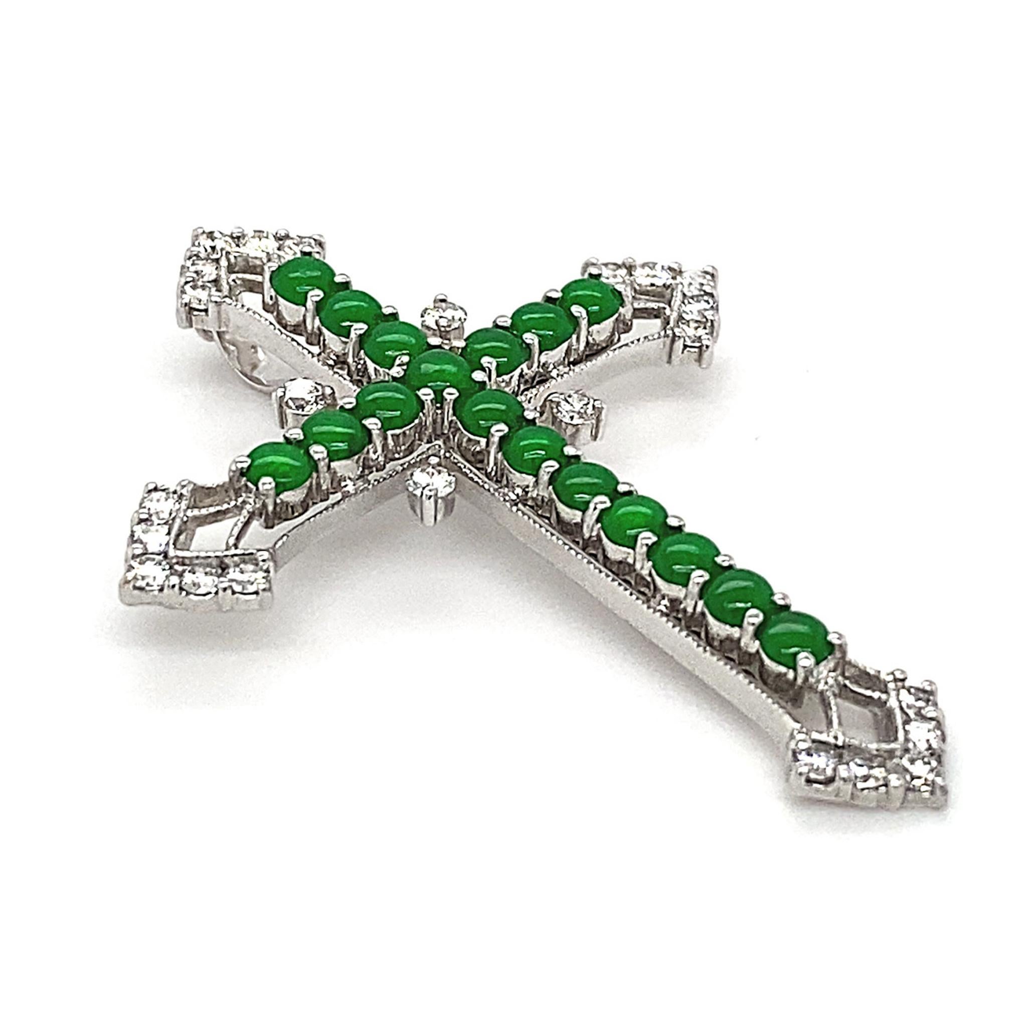 Giving the traditional cross symbol an oriental reincarnation, the House of Dilys' is proud to present this sensational 18K White Gold pendant, adorned with 17 Imperial Green Jade pieces that are incredibly rich in colour and lustre, totalling
