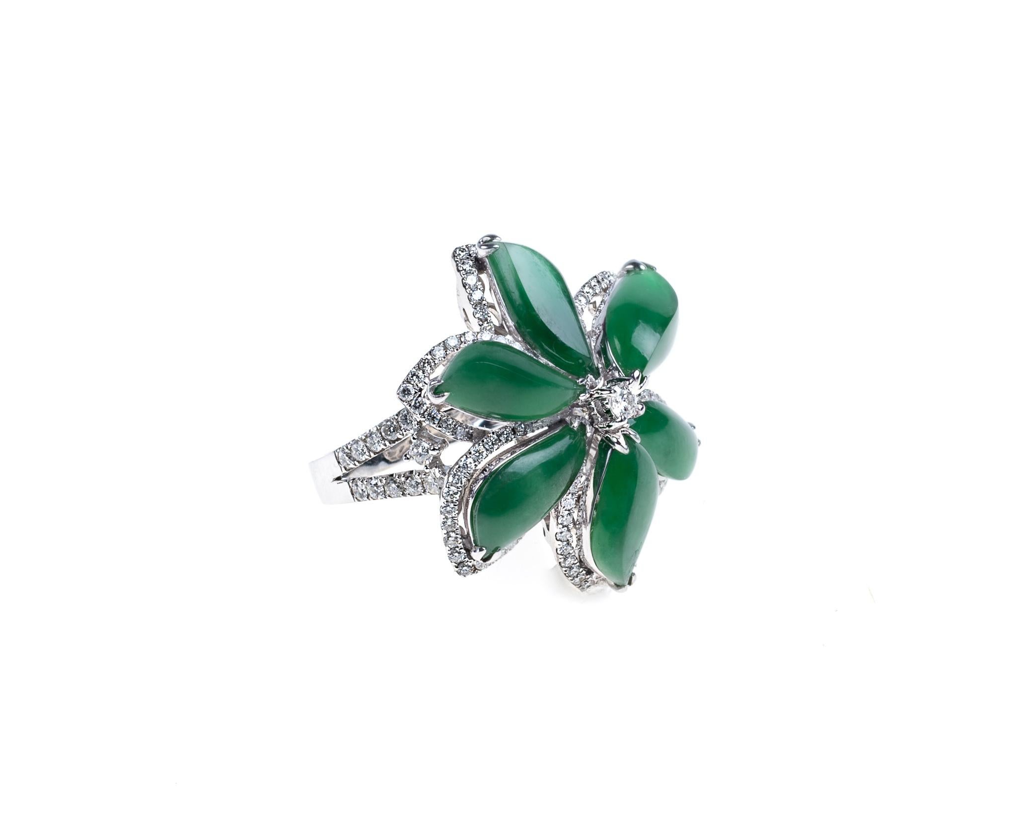 This all natural, untreated imperial jadeite jade carved into six flower petals creating a beautiful flower with round brilliant diamond totaling 0.95 carats on an 18K white gold diamond ring.  
It measures 0.87 inches (22.2mm) x 0.99 inches
