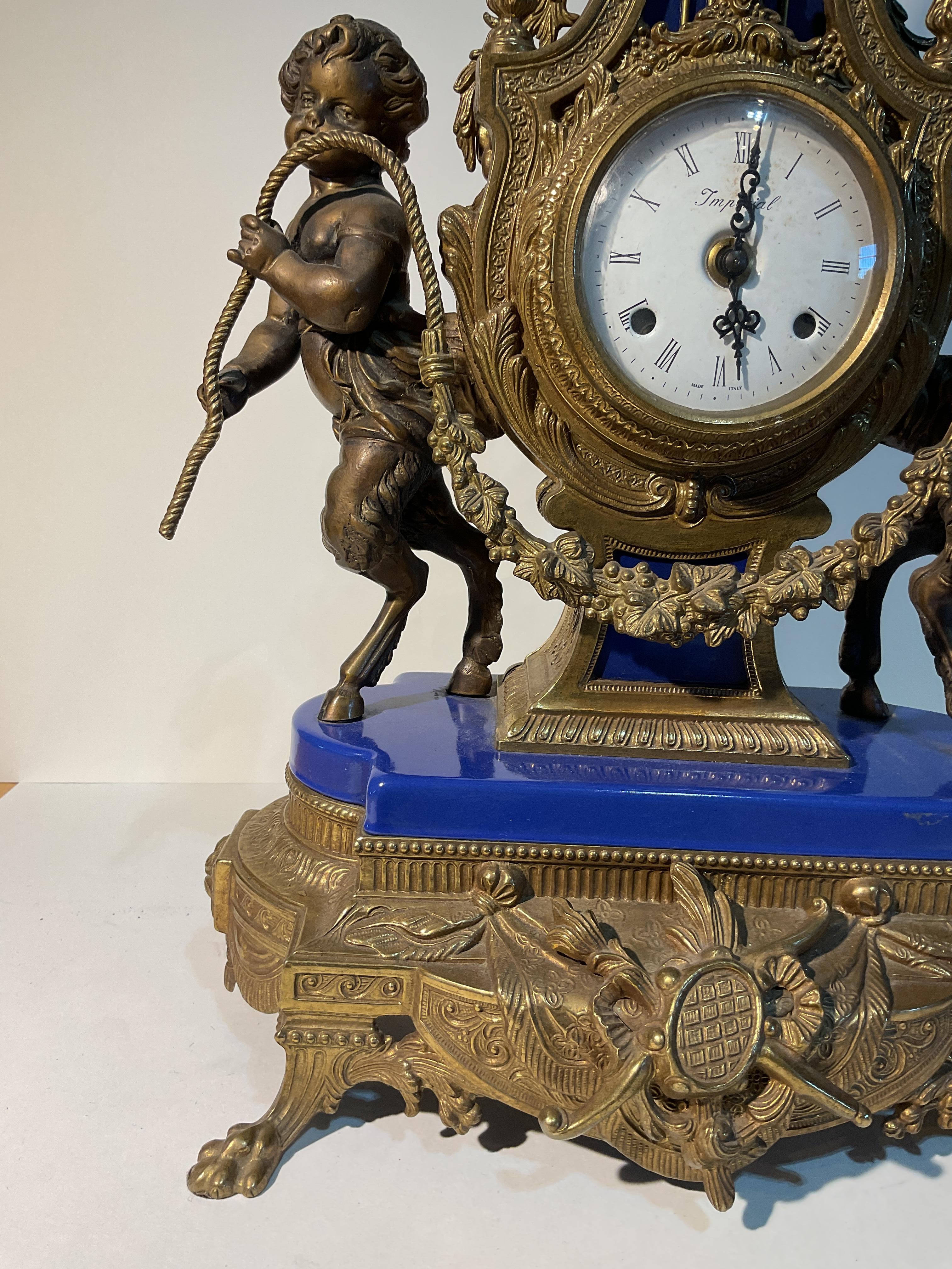 Imperial mantle clock
Made in Italy circa 1970s
Made of brass and vibrant blue enamel
Original key included 
Beautiful details 