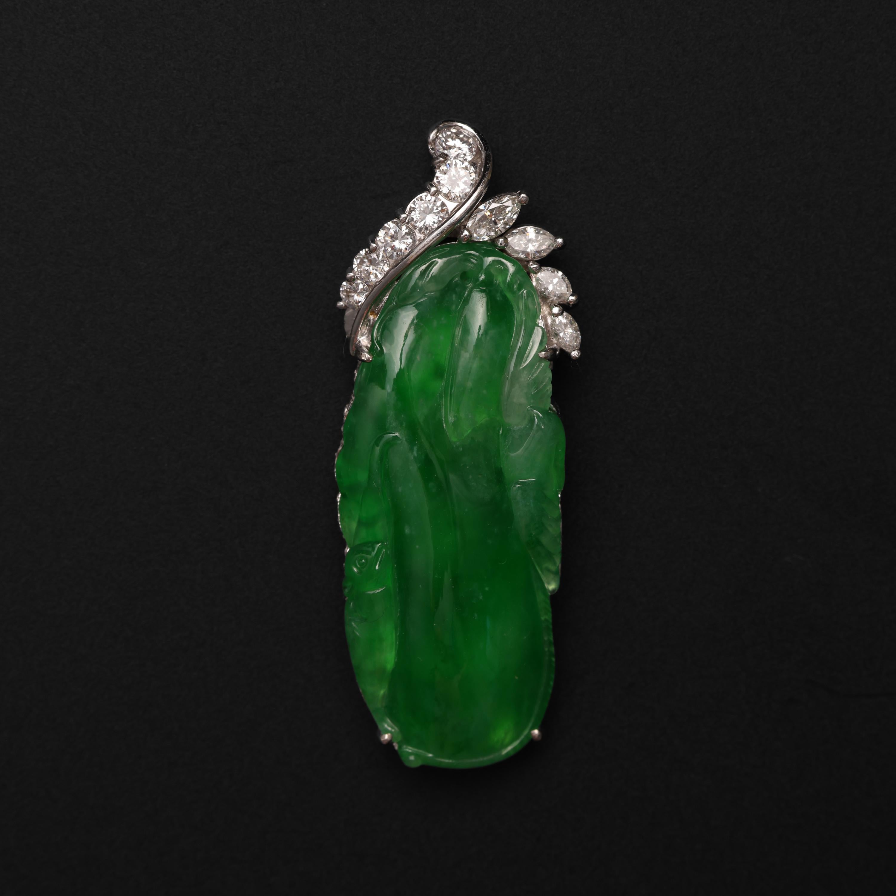 This imperial jade pendant features a glassy, highly translucent GIA-certified natural and untreated Burmese jadeite jade carving depicting birds among leaves. The emerald-green jade looks succulent, as if filled with liquid and light. 

This