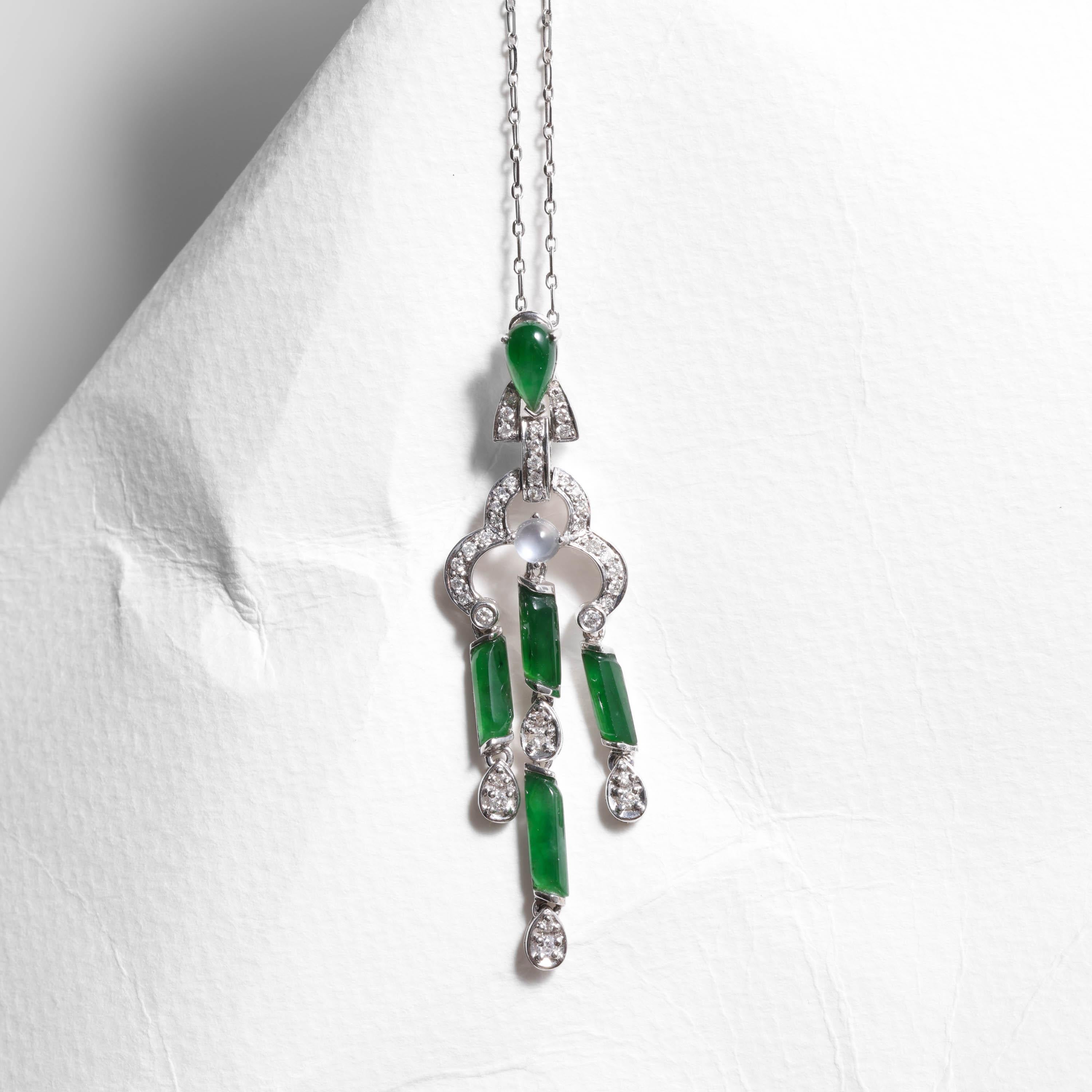 This delightful and one-of-a-kind pendant is rather like a tassel made of 18K white gold and imperial jade; the elongated free-form cabochons of glassy green jade dangle freely, as do the diamonds suspended from the jade. The result is a pendant