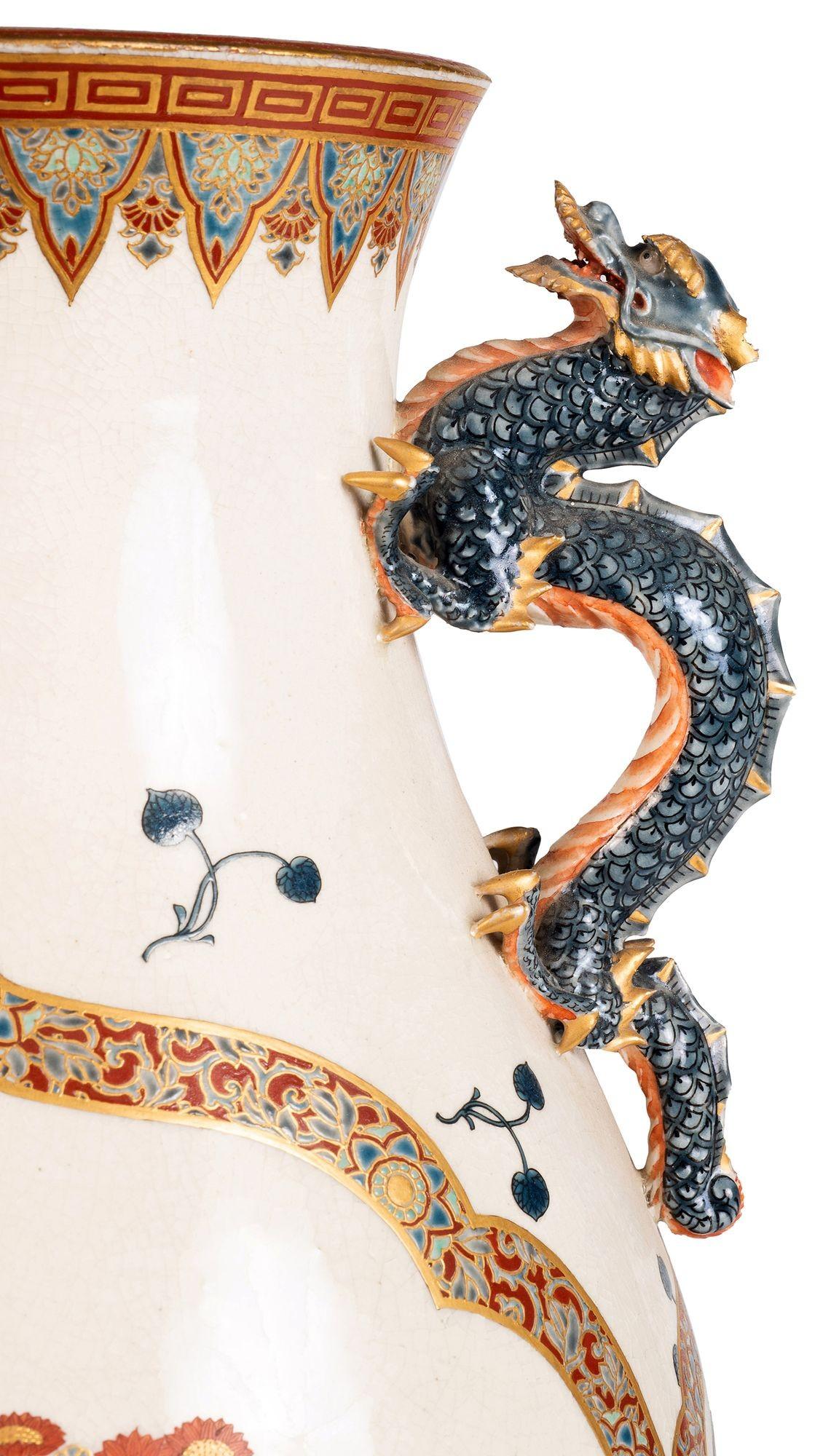 A fine quality Japanese Imperial Satsuma vase, having wonderful hand painted classical decoration of motifs, mythical Dragon handles to either side and an inset panel depicting blossom trees.

Batch 74 G9855/22 TNKZ