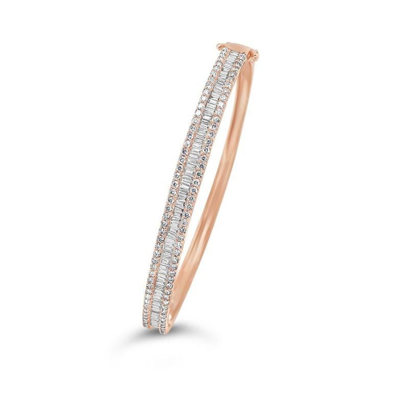 18CT rose gold, seventy six channel set Diamond tapered baguettes and one hundred claw set round brilliant cut diamonds crafted into a hinged bangle.

Diamond Baguette Weight: 1.40ct 
Diamond Baguette Grade/Colour: VS1,F.
Dimensions = 2.2mm(L) x