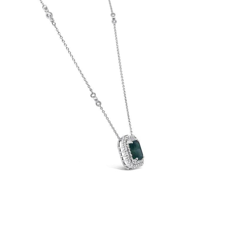 A stunning 18CT white gold emerald cut emerald embedded within a set of round brilliant cut diamonds on an oval link with bezels chain necklet and polish finished. 

Emerald Weight: 1.70ct 
Emerald Grade/Clarity: Medium 
Dimensions: 7.2mm(L) x