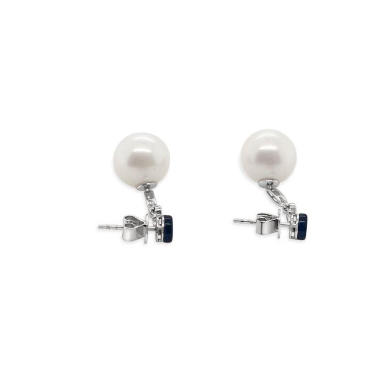 A beautiful pair of White Gold, South Sea Pearl and round brilliant cut diamonds, Pierced Drop earrings in a stunning 18CT White Gold setting. 

Pearl Grade: South Sea, White/Pink pearls, Lustre - 