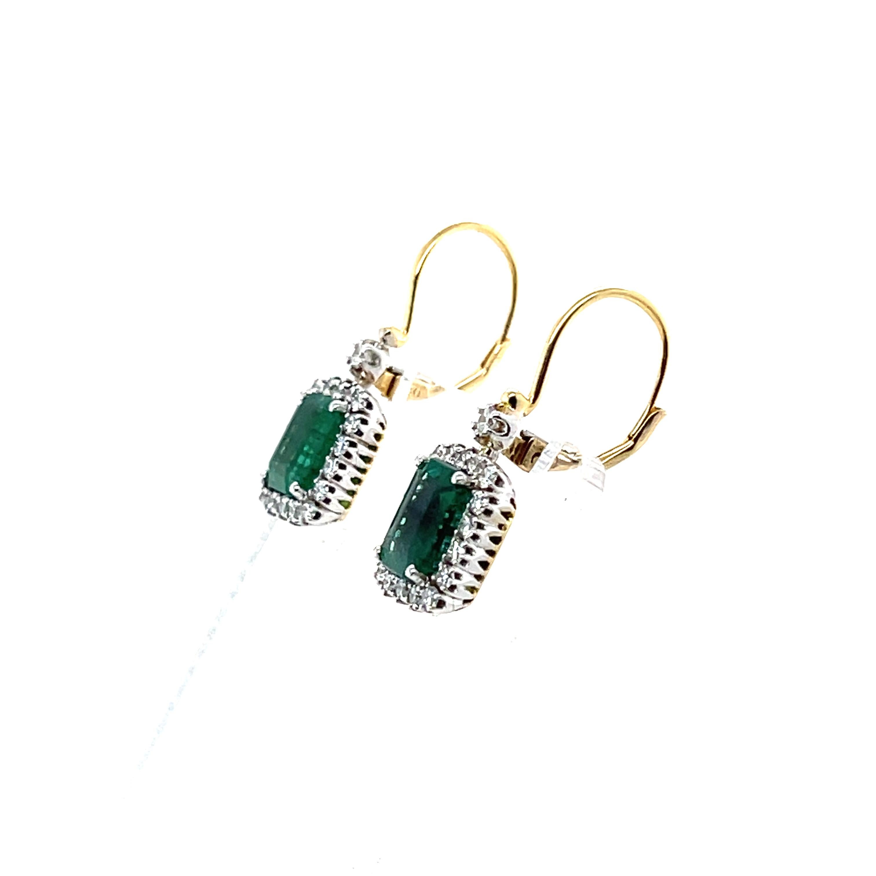 An outstanding set of Emerald Cut emerald earrings with stunning round brilliant cut Diamonds, on a beautiful French Hook earring design.

Emerald Weight: 2.87ct
Emerald Colour: 