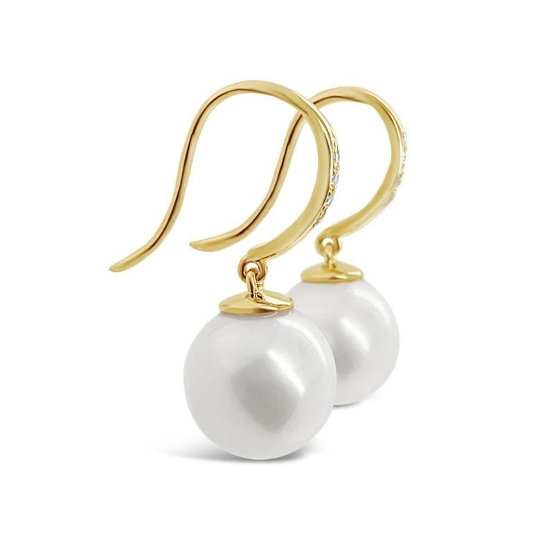 A pair of 18CT Yellow gold Pearl and round brilliant cut Diamond encrusted shepherds hoop.

Pearl Origin/Grade: South Sea cultured white/pink, Lustre - 