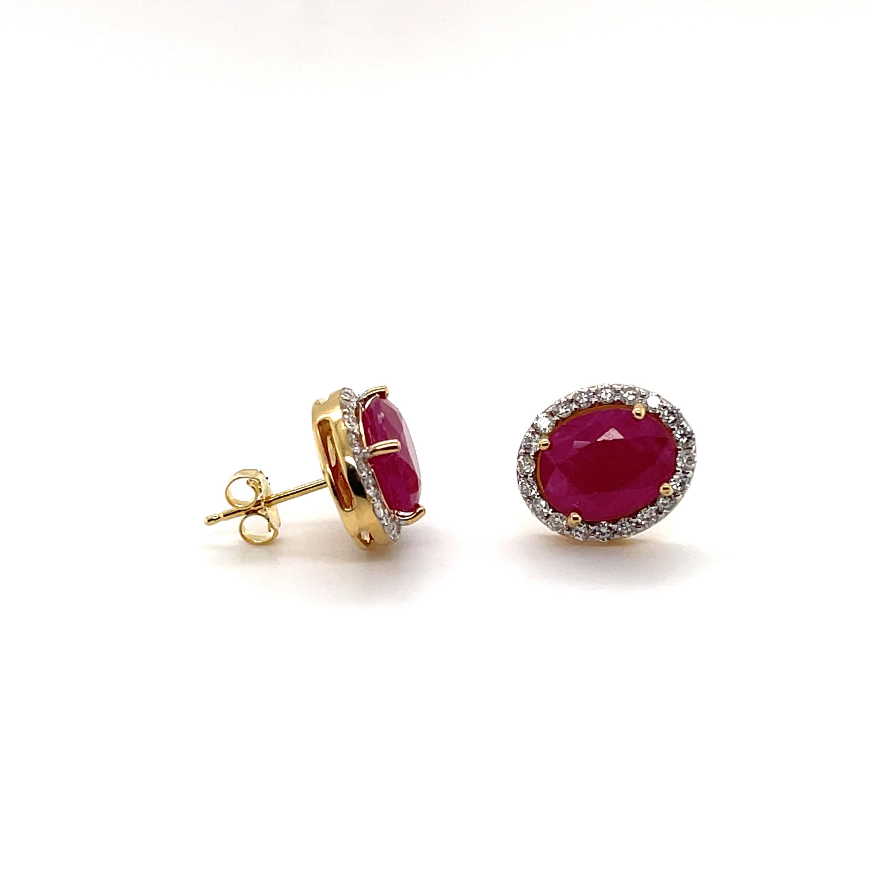 Two claw set oval shaped rubies, crafted in Eighteen Karat Yellow Gold, featuring a remarkable set of claw set round brilliant cut diamonds, complemented with a beautiful polish finished design. 

Total Ruby Weight: 6.36ct
Ruby Grade/Colour: 