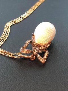 Imperial Russian 14 Karat Gullioche Enamel, Egg Pendent with Diamond Bow