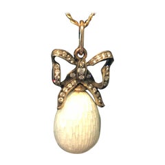 Imperial Russian 14 Karat Gullioche Enamel, Egg Pendent with Diamond Bow