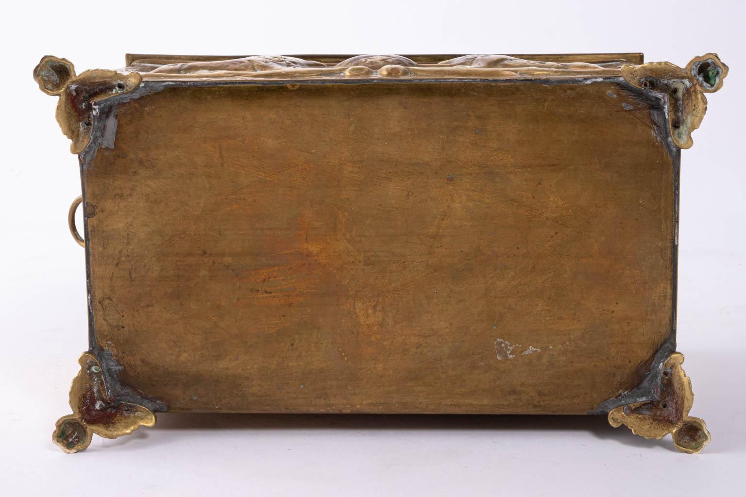 Solid brass humidor embossed with double Eagle insignia of Russia's Imperial Romanov family and the double lions of the British Empire, circa 1907. The box is raised on lion's paw feet with an interior that features a removable tin liner. Made in
