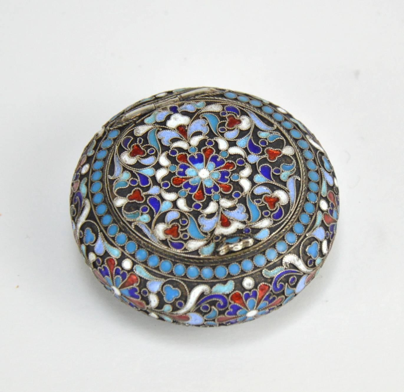Imperial Russian cloisonné enamel and silver box. Finely hand decorated with a multi-color enamel scrolling foliage, flowers and pan-slavic ornamentation against a gilt stippled background. Hallmarked with '84 Kokoshnik' Imperial Russian Silver