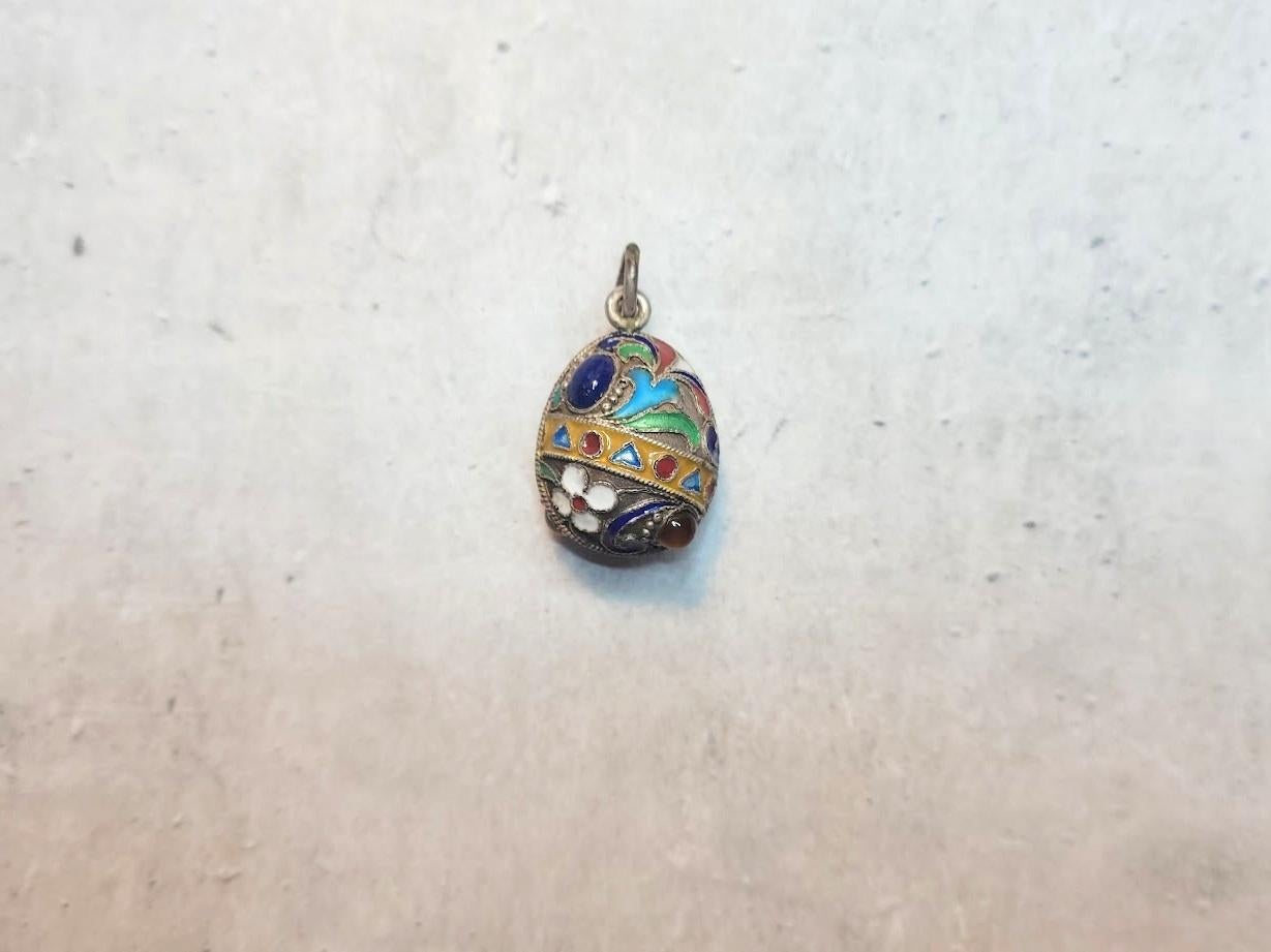 Presenting silver cloisonne enamel egg pendant is a unique piece that echoes the style craftsmanship of Medieval Russia. We attribute this egg pendant to the late 19th or early 20th century, possibly crafted by the renowned Fabergé jewelry company