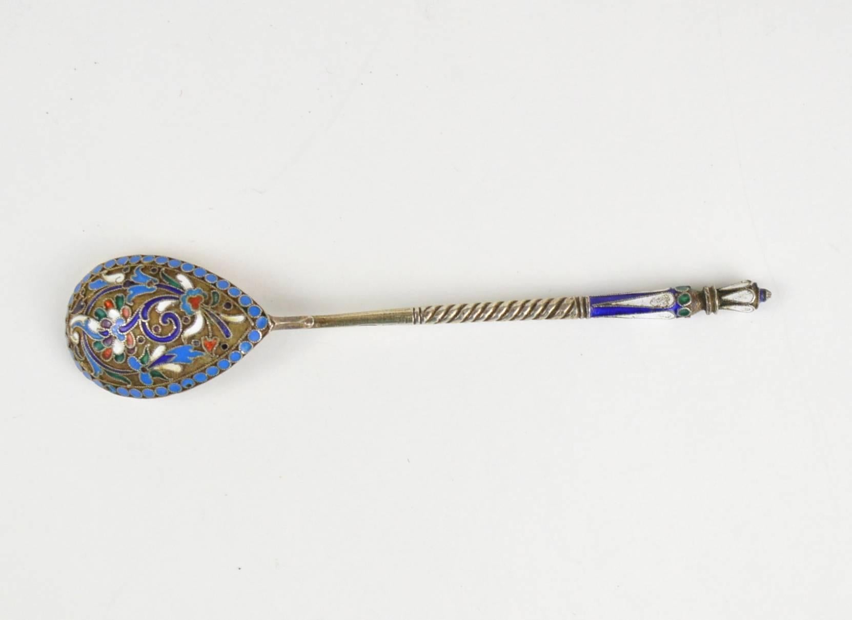 Imperial Russian cloisonné enamel and silver spoon. Finely hand decorated with multi-color enamel scrolling foliage, flowers and pan-slavic ornamentation against a gilt stippled background. Hallmarked with '84' imperial Russian silver standard and