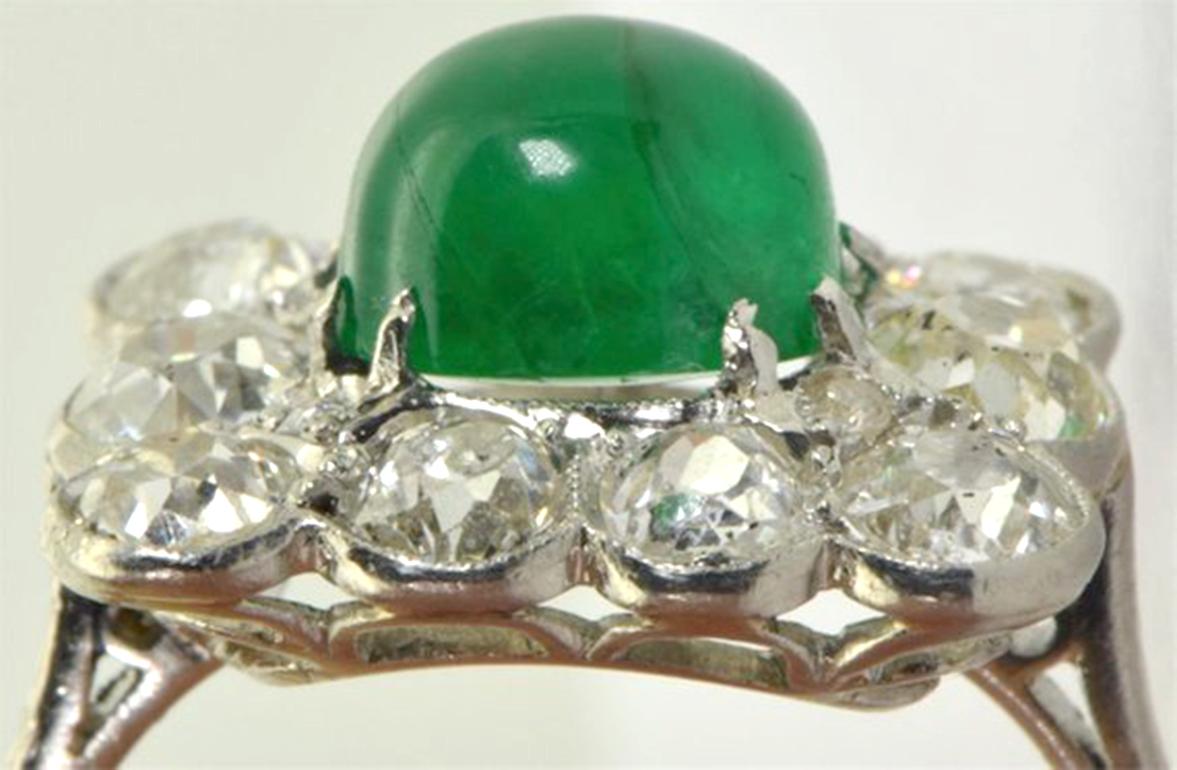Imperial Russian Faberge 1.5ct Colombian Emerald & 2.5ct Diamonds Platinum ring

The central Emerald is Cabochon cut with the finest deep intensive vivid green color. 

The diamonds are old Mine cut with the finest snow white E/G color,VS2-SI1