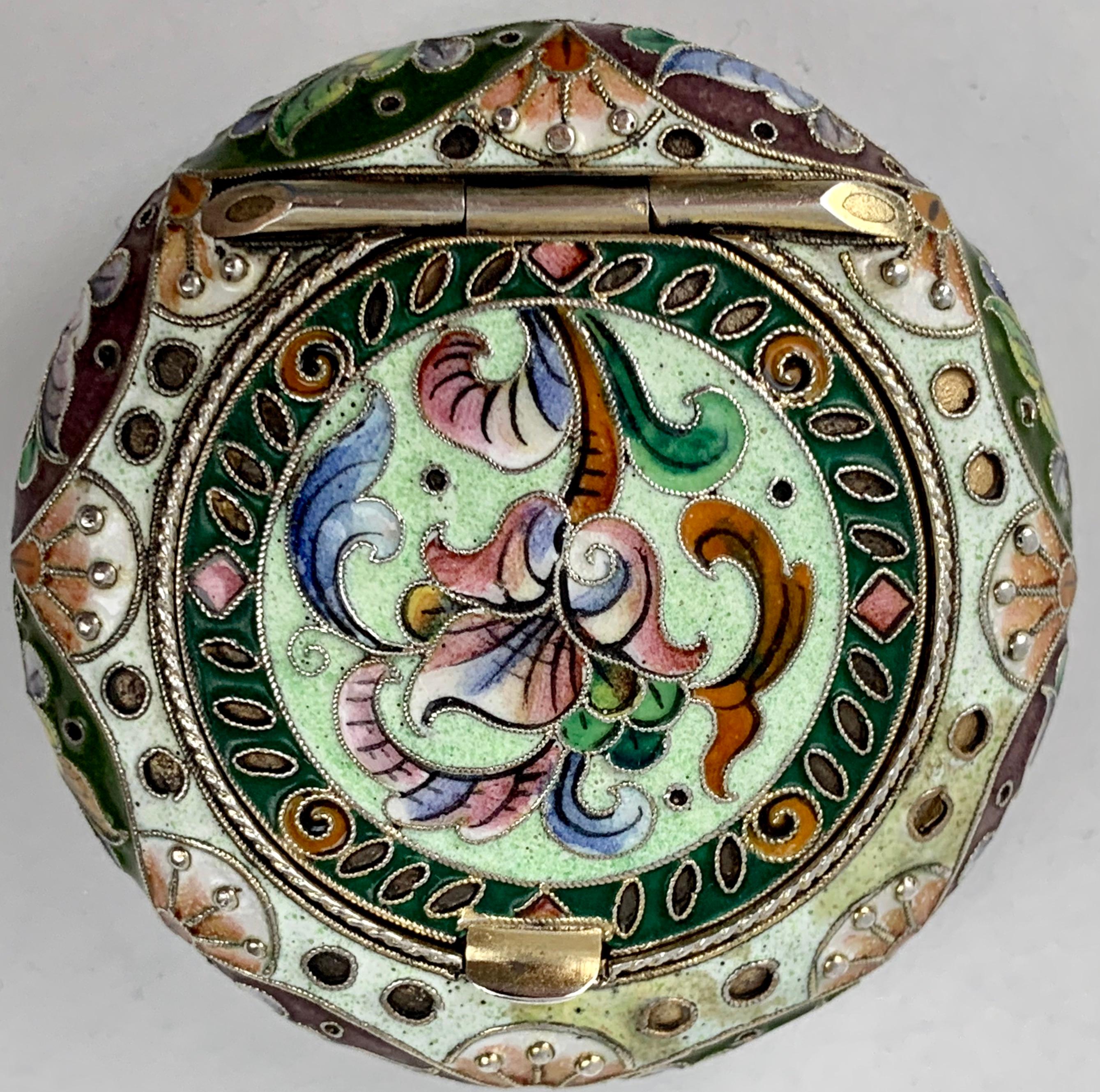 Imperial Russian polychromed enameled silver pill box. Hallmarked with Russian silver standard of 84 zolotnicks. The kokoshnik mark of a female with right facing profile indicates that it was made in Moscow after 1908. The silversmith appears to be