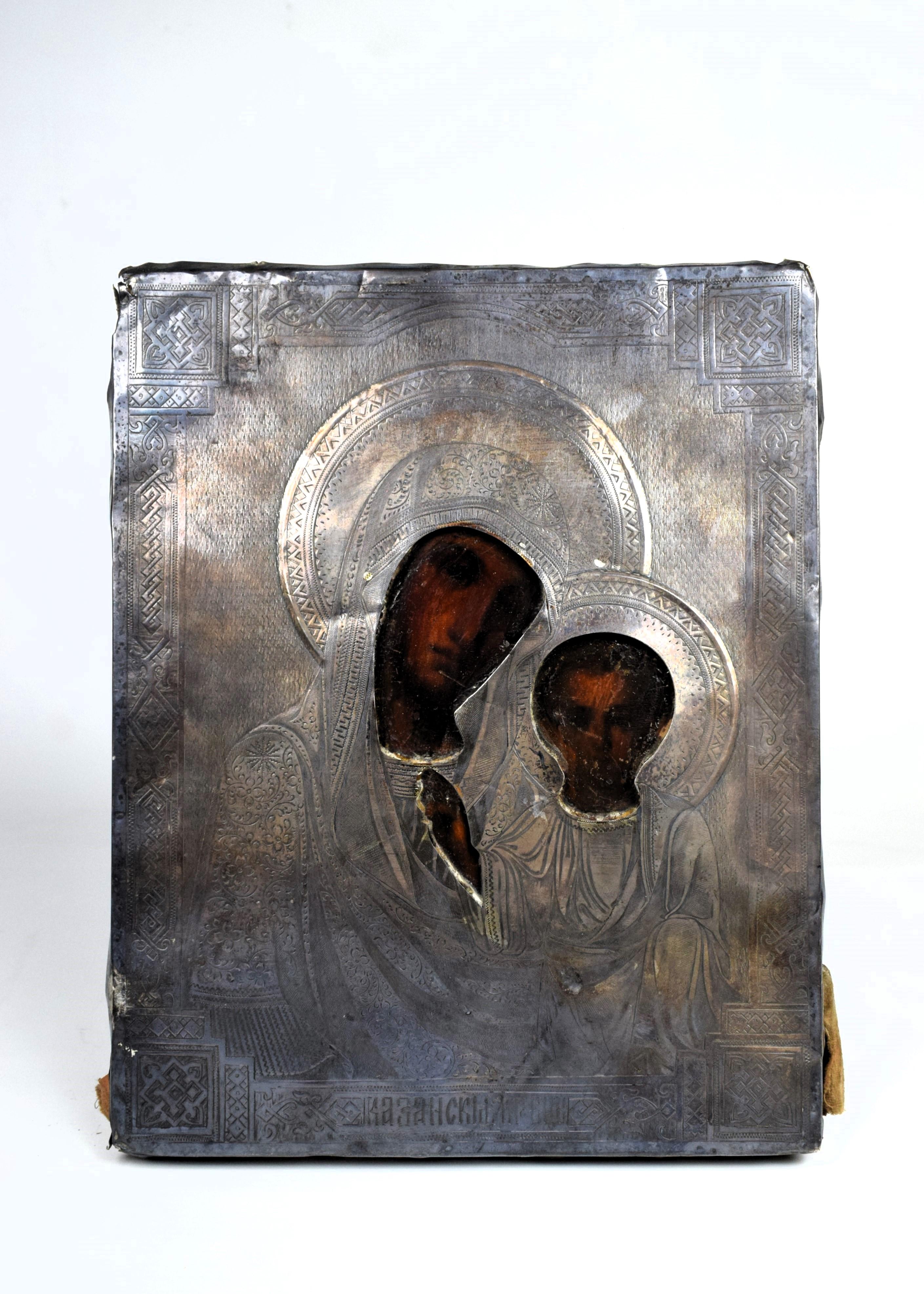 Imperial Russian Silver-Gilt Depicting Icon of Madonna and Child, 19th Century

The silver surface of the rizza is adorned with intricate embossing and engraving, creating a textured and visually captivating background for the central depiction of
