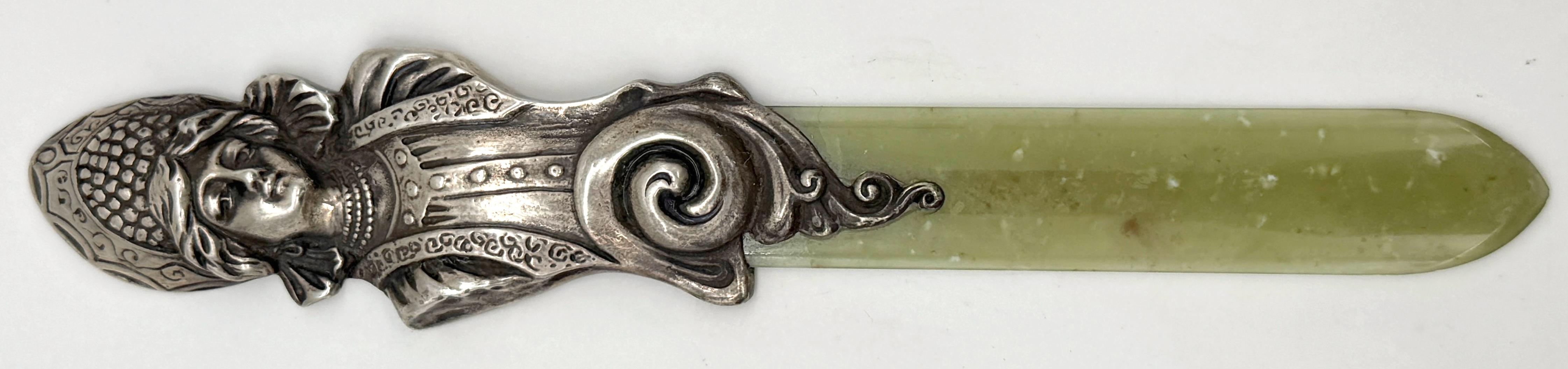Imperial Russian Silver & Nephrite Page Turner with Kokoshnik Maiden, Marked “BA,” Moscow, circa 1890–1910

A rare and luxurious Imperial Russian page turner, masterfully combining hand-chased silver and carved Siberian nephrite. The piece is