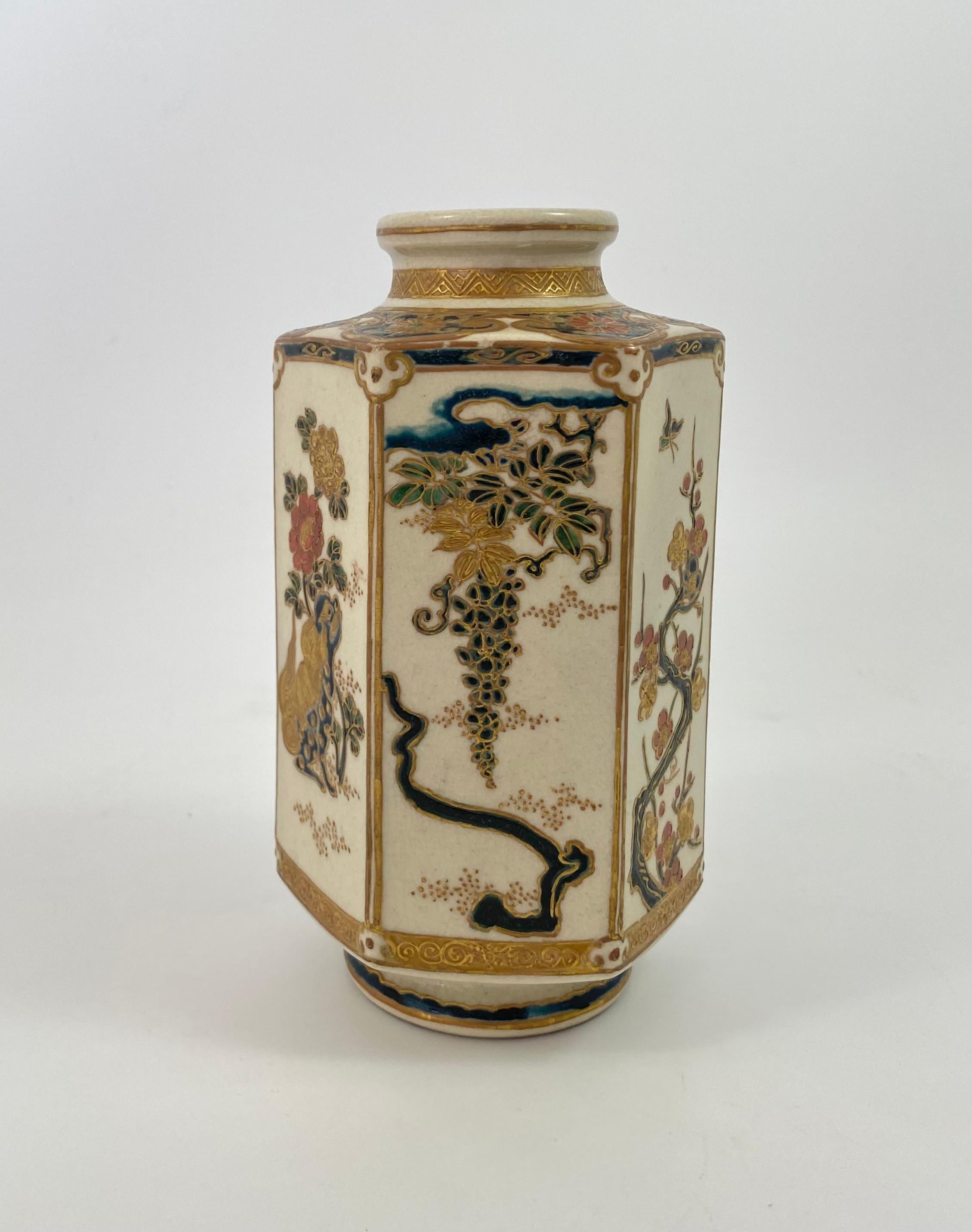 Imperial Satsuma vase, signed Gyokusen, Japan, Meiji Period. The hexagonal shaped vase painted with a panel of a seated Shi Shi dog, beneath a flowering plant, the reverse with Ho Ho bird perched upon a branch. The other panels with flowering