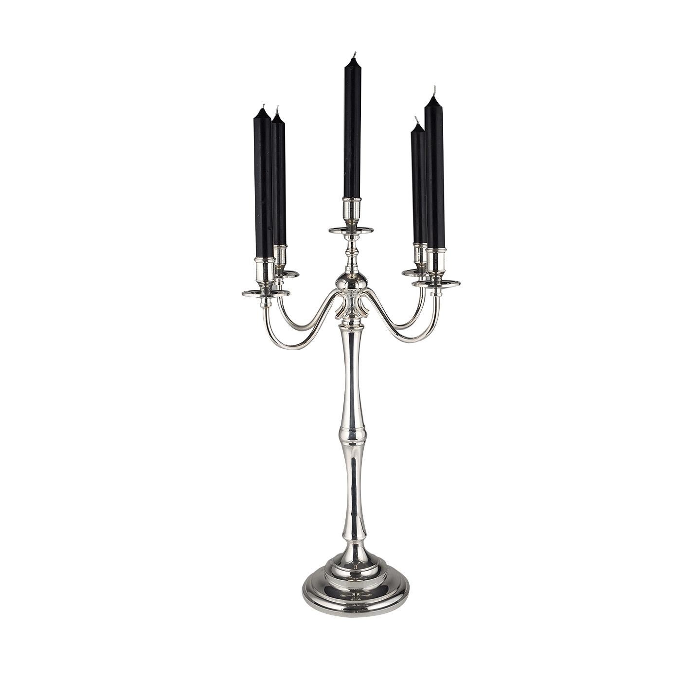 This candleholder has a classic charm and will be an elegant addition to any home, thanks to its exquisite silhouette, the sinuous curves of its six arms, and the cool glow of the silver with which it is plated. It can be used to add a touch of
