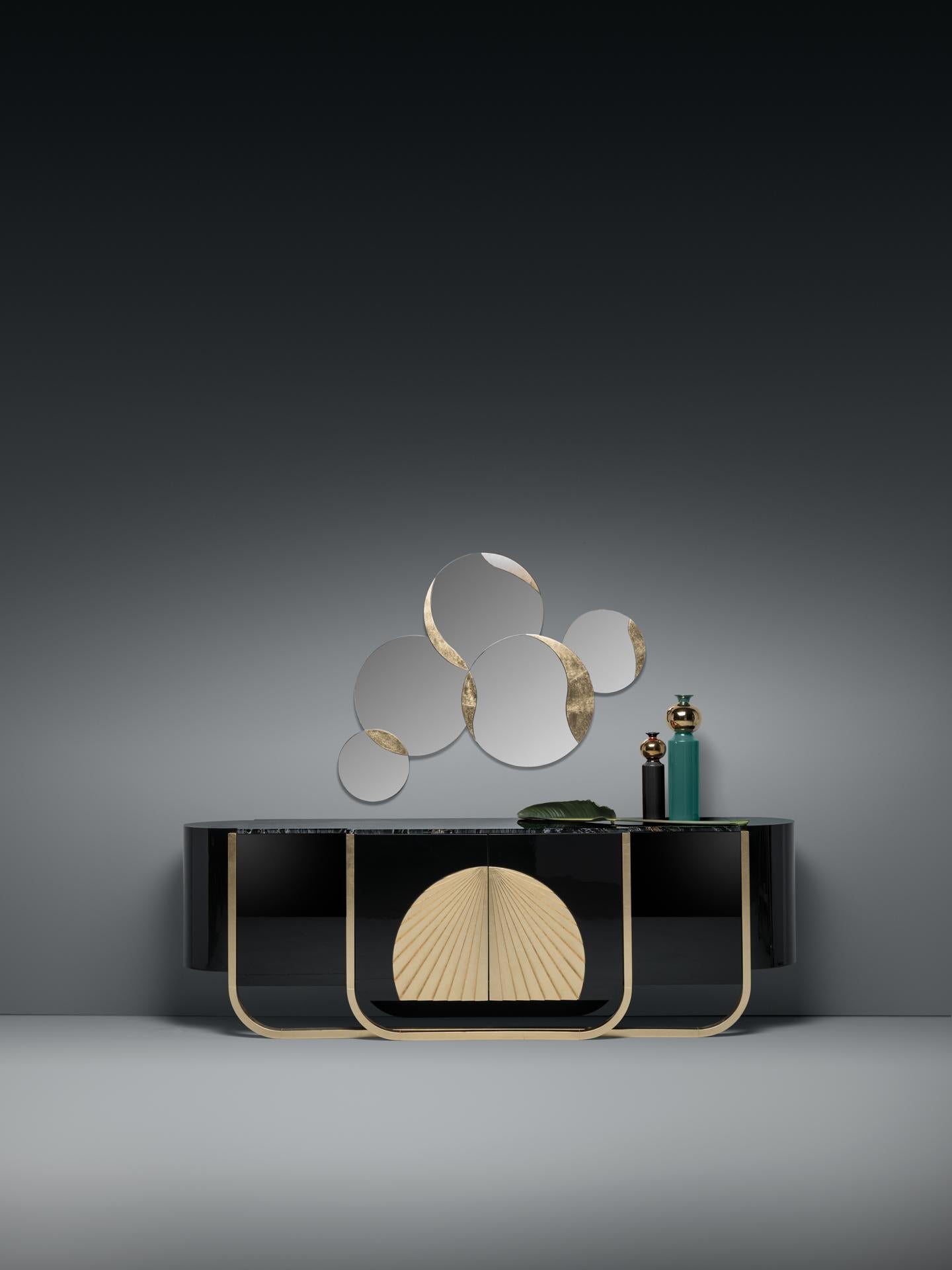 The Imperial Sideboard is a striking piece of Art Deco–inspired design, where bold character and refined luxury meet in perfect harmony. Crafted in solid wood and finished in high-gloss lacquer, this sideboard brings a powerful sculptural presence