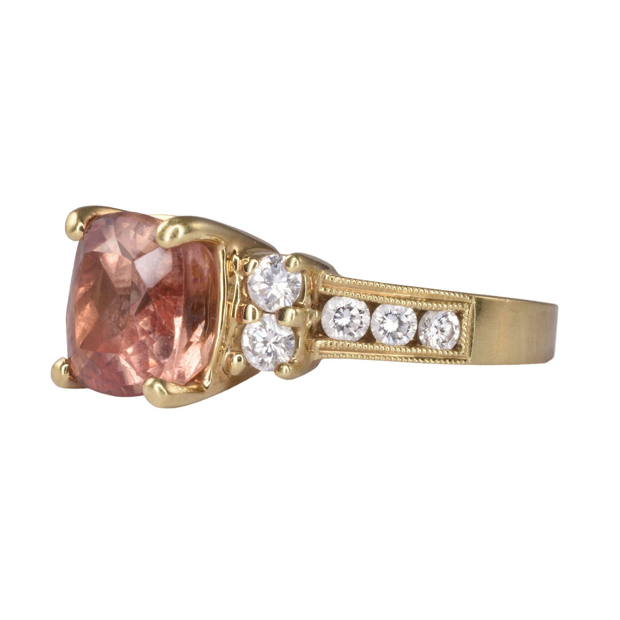 Estate imperial topaz 18K gold ring. This 18 karat yellow gold ring features a 2.85 carat imperial topaz that is accented with .40 carat total weight of diamonds. The diamonds have VS clarity and G-H color. This imperial topaz ring is a size 6.25.