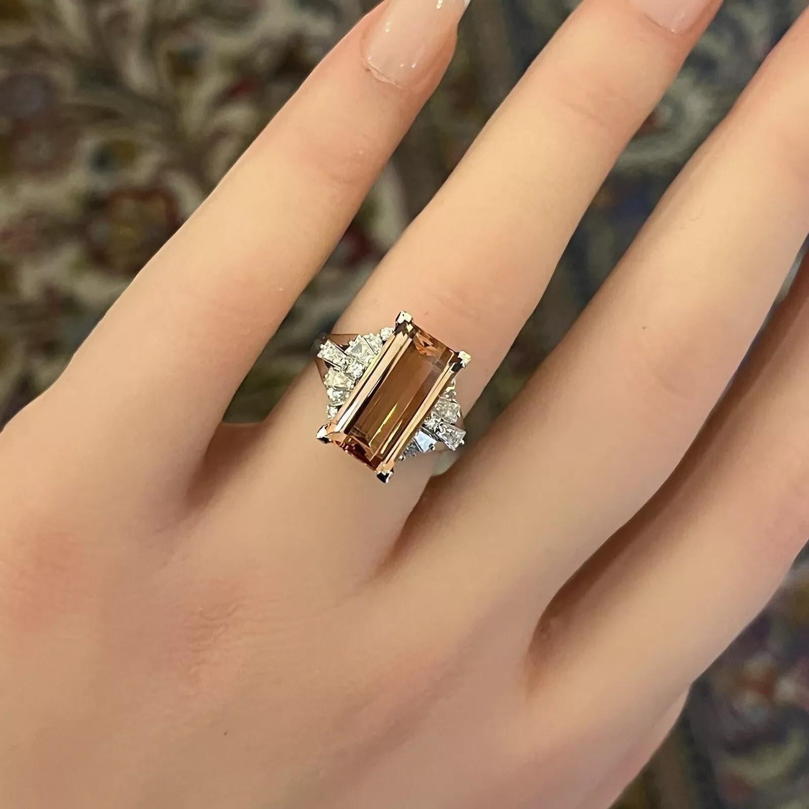 Imperial Topaz 4.98 ct and Diamond Ring in Platinum 

Imperial Topaz and Diamond Ring features a very clean 4.98 carat Natural Imperial Topaz with an Emerald cut accented by Round Brilliant and Baguette Diamonds, all set in Platinum.

Total imperial