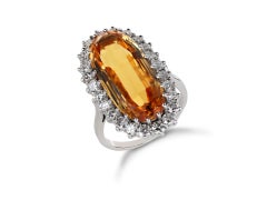 Imperial Topaz and diamond cluster ring, English, 1983.