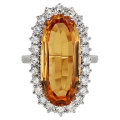 Imperial Topaz and diamond cluster ring, English, 1983.