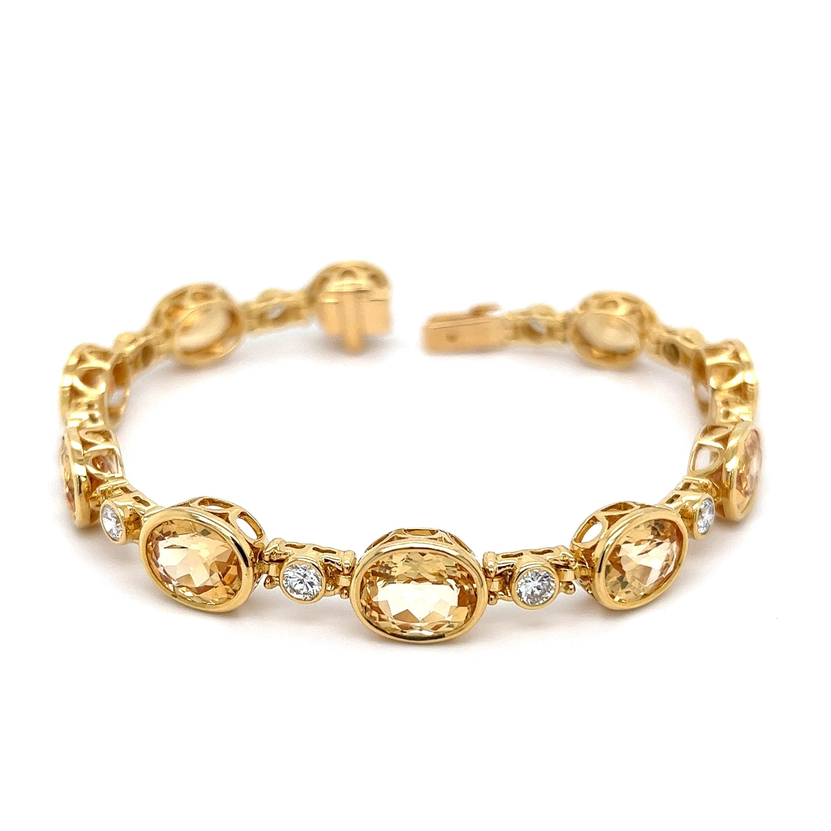 Simply Beautiful! Imperial Topaz and Diamond Gold Bracelet. Featuring 10 matching Imperial Topaz weighing approx. 30tcw. Interspaced with Diamonds, weighing approx. 1.70tcw. Dimensions 7” L x 0.34” W x 0.20” H. Hand Bezel-set; Hand crafted 18K