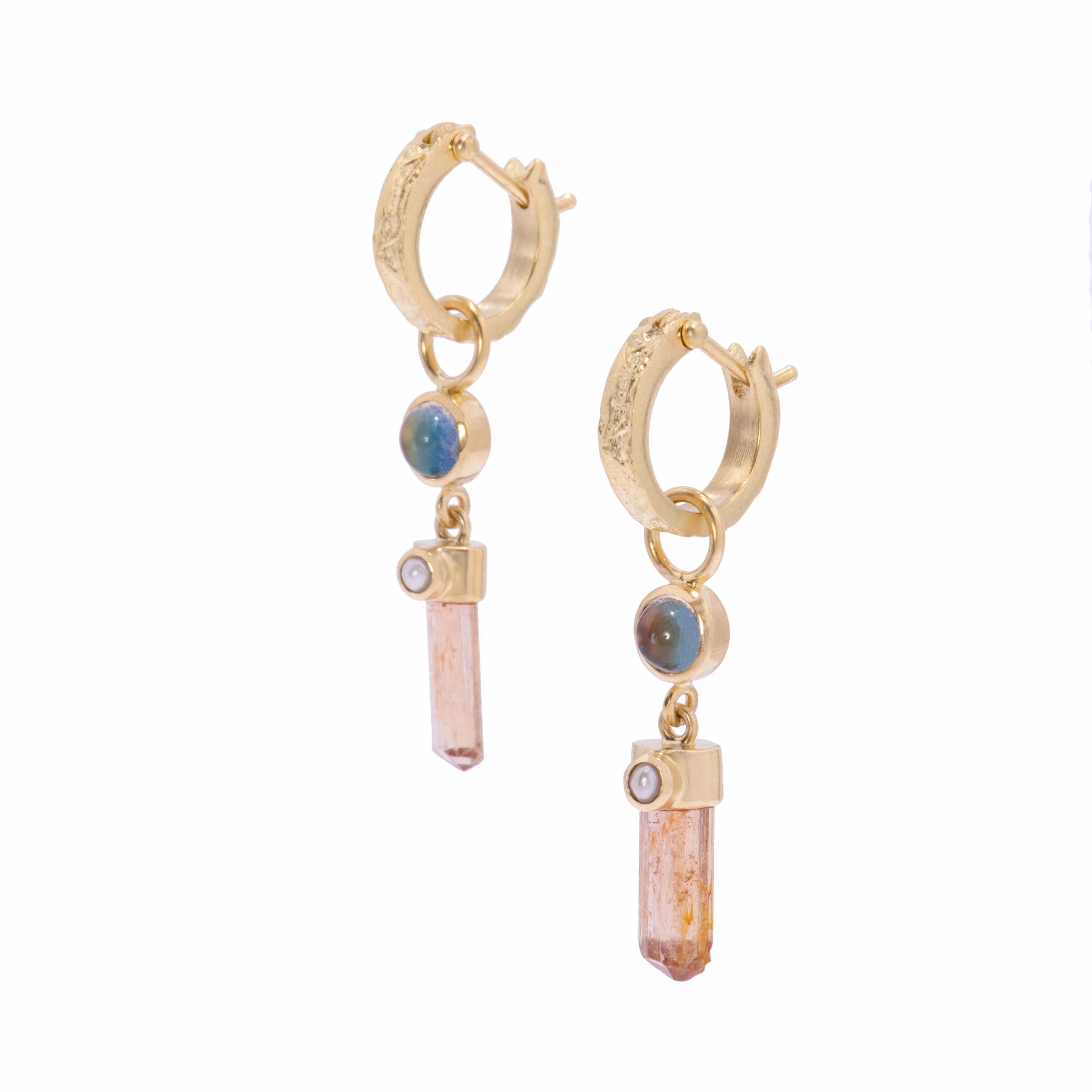 Smoky, peach crystal wands are the focus of Imperial Topaz Crystal Drop Earrings handcrafted in our studio in 18k gold. A pair of imperial topaz crystals 4.85 ctw. are capped with white pearls and drop from bezel set rainbow moonstones 1 ctw. with