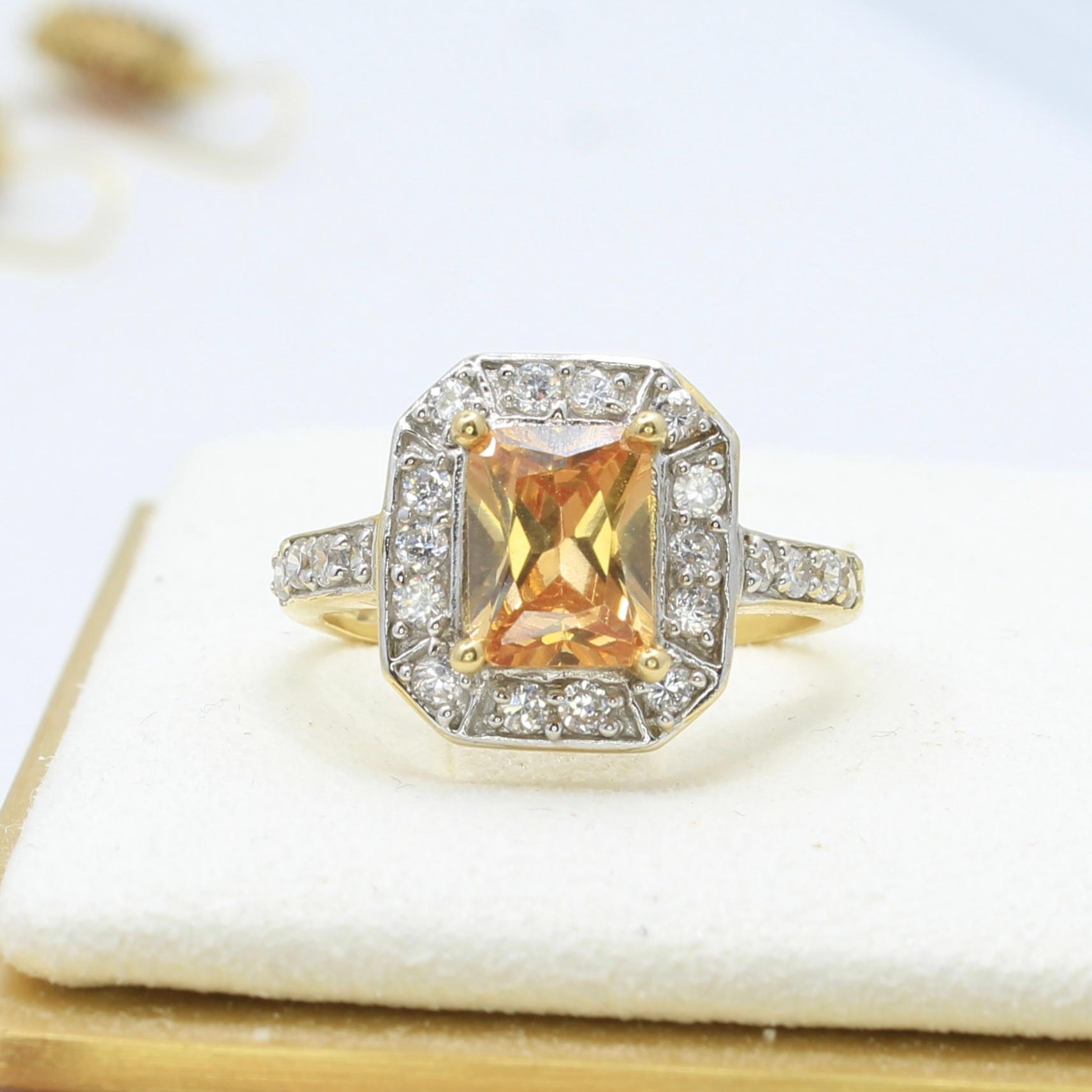 The unique feature of this imperial topaz is its natural peachy orange color, created by natural color centers within the gemstone, rather than by treatment. Its exceptional clarity and precision cut make it stand out among other topaz stones.