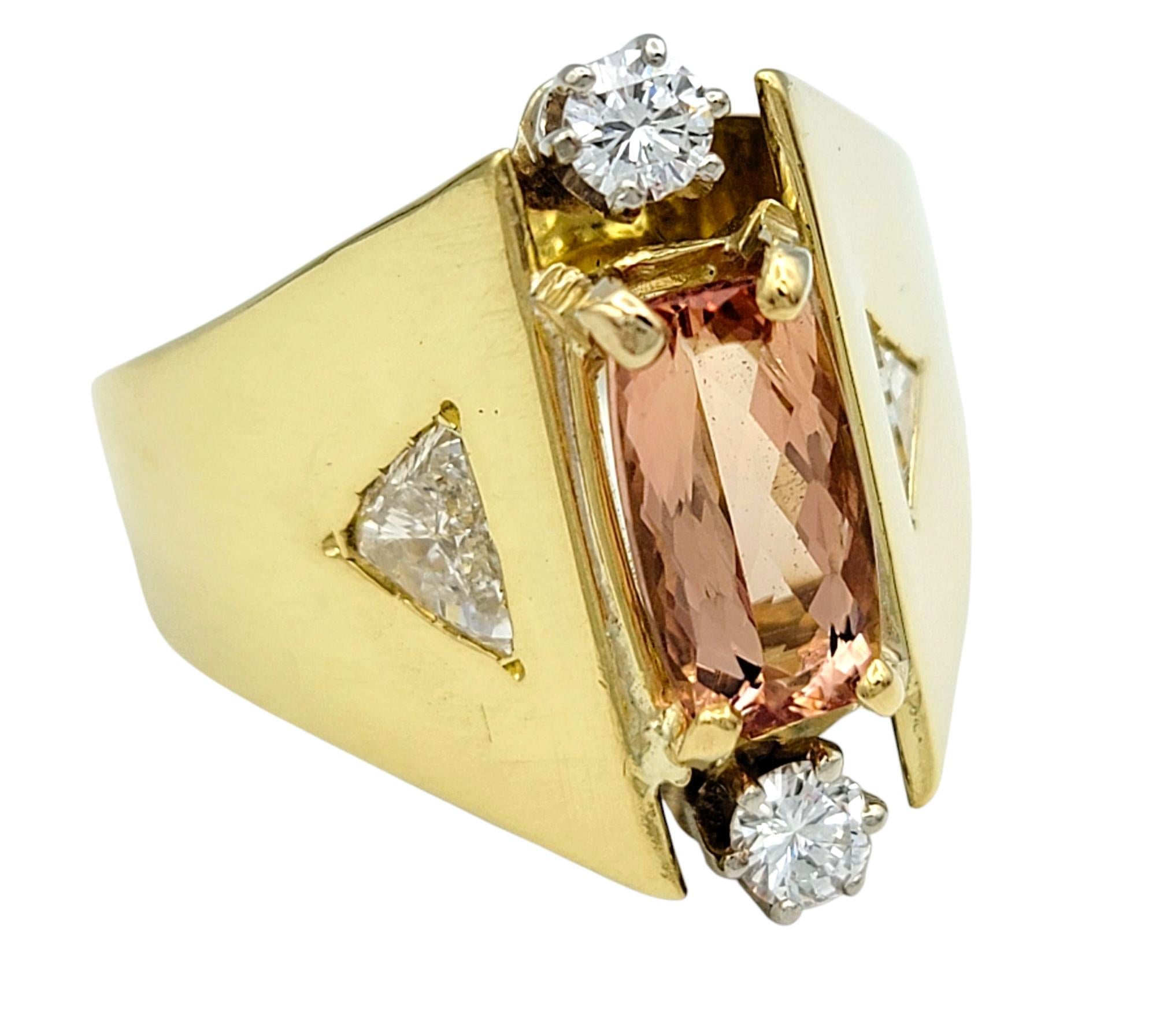 Ring Size: 10

Striking and sculptural, this cathedral-style ring showcases a mesmerizing imperial topaz in a dynamic architectural design. Set in a luxurious combination of 18 karat yellow and white gold, the ring features a rectangular cushion-cut