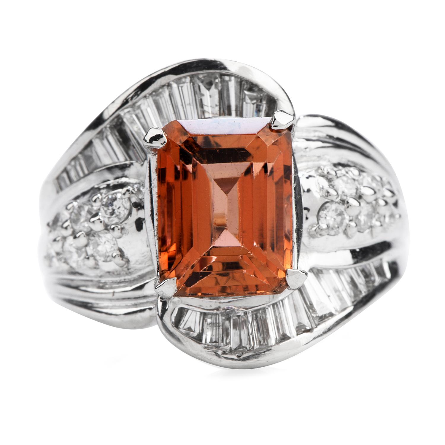 This sunset color orange Imperial Topaz Diamond Cocktail Ring is crafted in luxurious Platinum.

An emerald-cut natural Topaz adorns the center of this stately piece weighing approx. 3.44 carats. Round and baguette-cut diamonds wrap around the