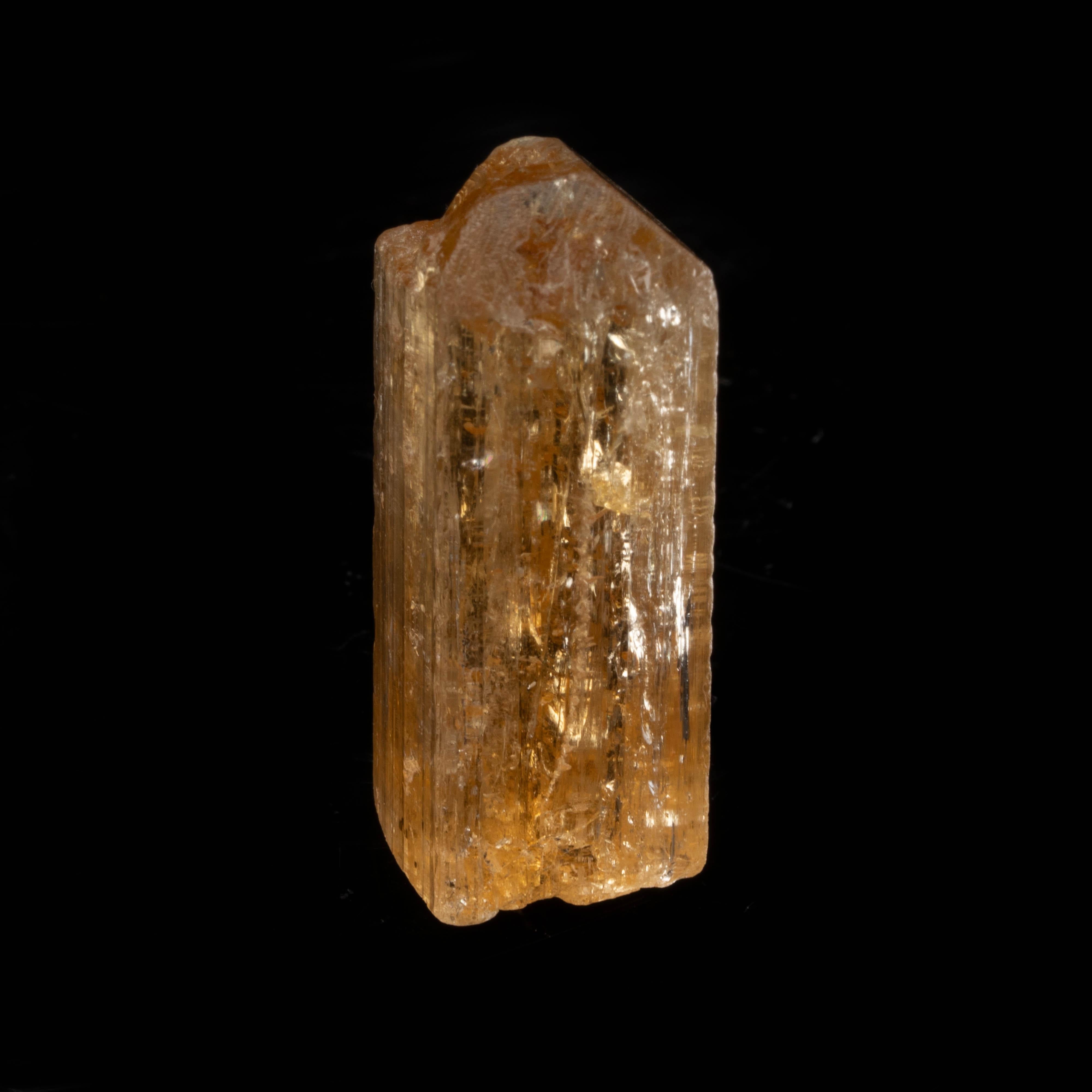 Ouro Preto, Minas Gerais, Brazil

This true imperial topaz single crystal was sourced from the small district of Ouro Preto, Brazil – famous for its topaz – and displays a good termination and gorgeous natural striations and luster.

Dimensions: