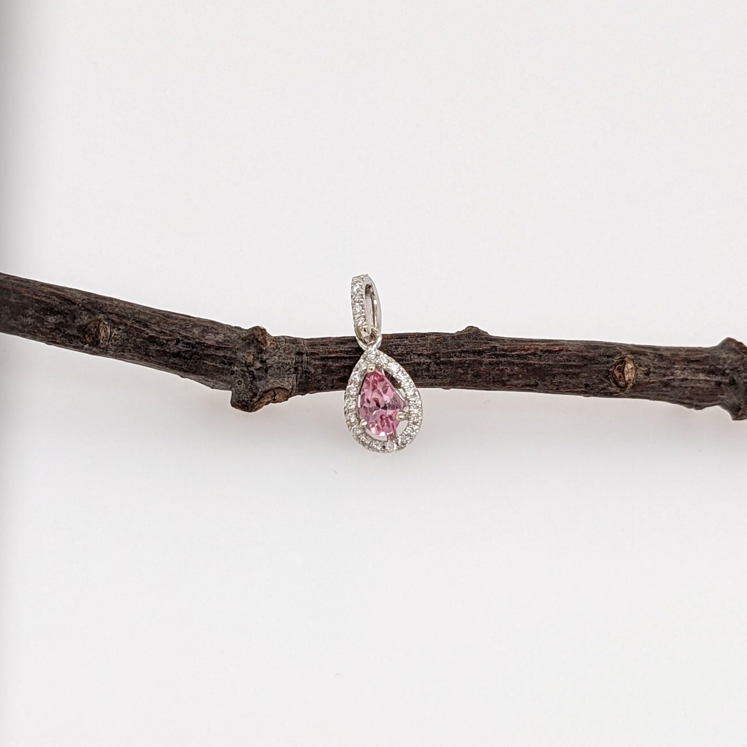 A gorgeous pendant featuring a padparadscha pink colored Imperial Topaz, pear cut and set in solid 14k white gold with all natural earth-mined diamond accents. Perfect for gifts, anniversaries, or any special occasion! 

Specifications

Item Type: