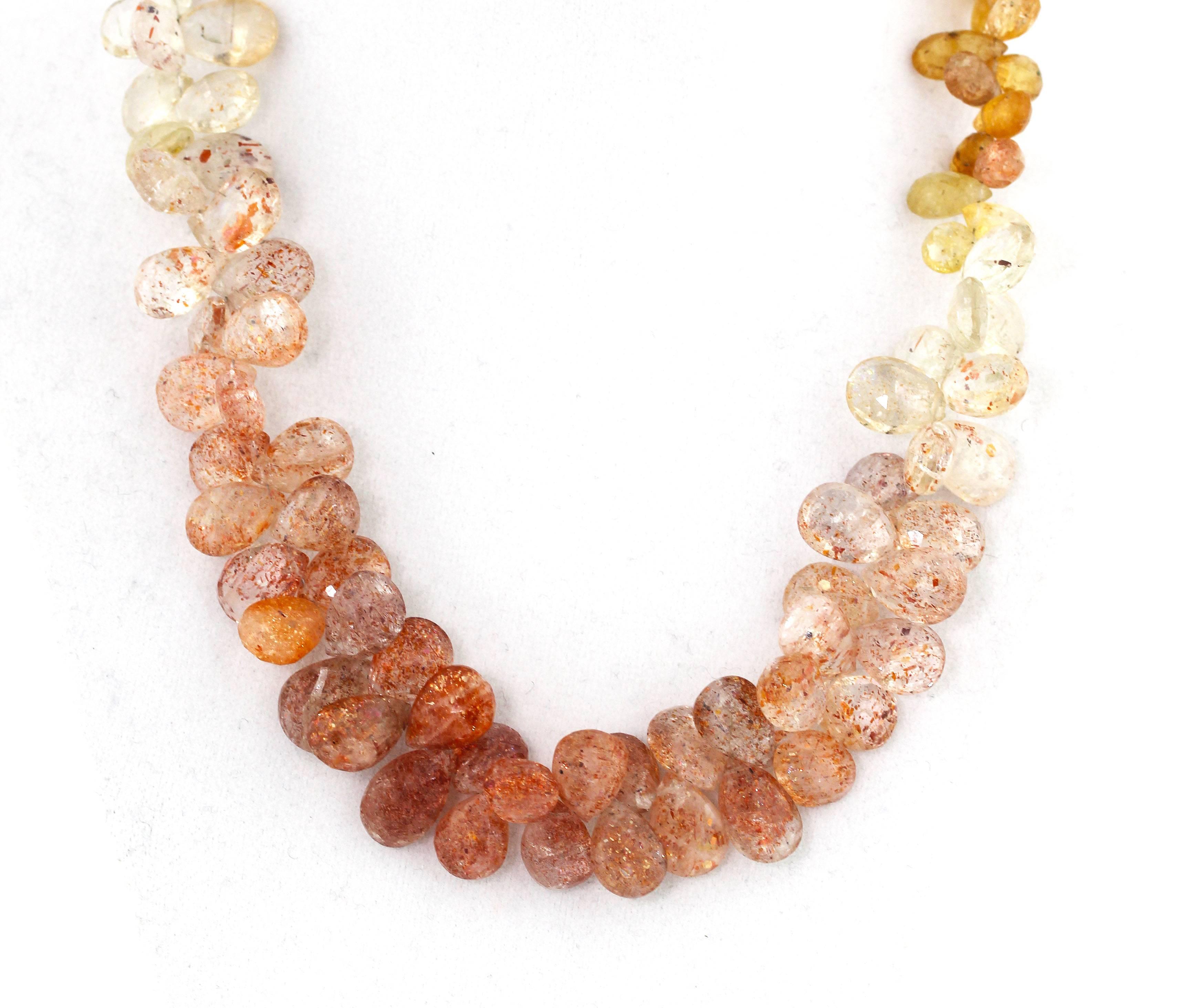 Glittering brilliant handmade checkerboard gem cut petals of the rare Imperial Topaz gemstones (from Brazil) are multi colored and are set in an 18 inch necklace with a gold plated (Vermeil) clasp.  The largest petals are approximately 14 mm x 9 mm.