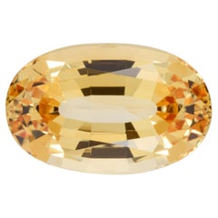 Topaze impériale ovale de 10,57 carats : Gemme rayonnante pour les créations de bijoux de luxe personnalisés