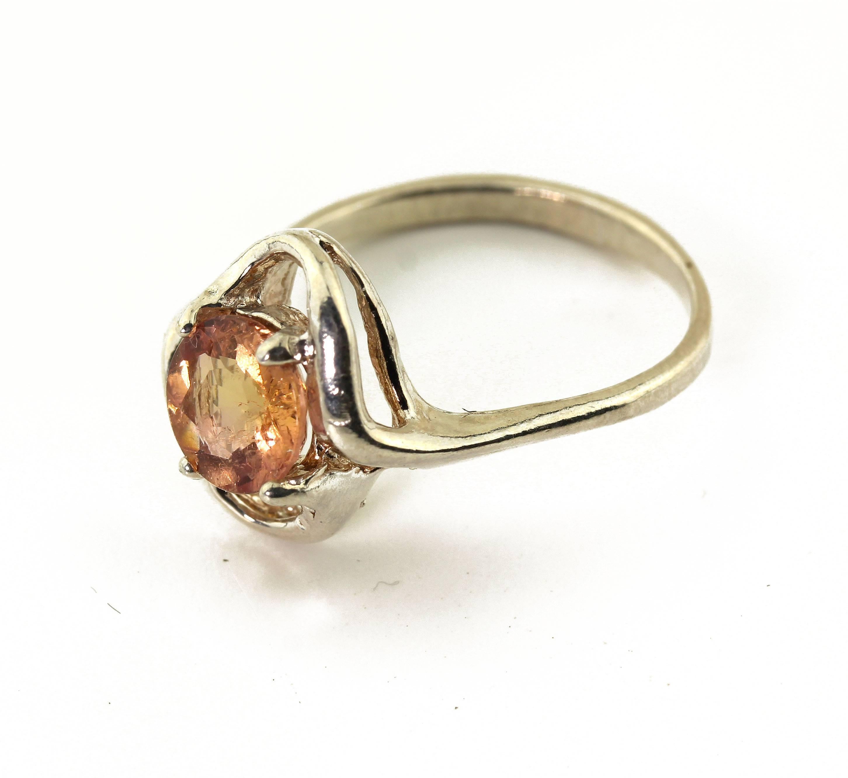 This glittering 7.3mm natural 1.4 carat Imperial Topaz is set in a unique handmade Sterling Silver ring size 7 (sizable).  This superb quality came from the famous Brazilian mine in Minas Gerais, Brazil.  More from this seller by putting gemjunky