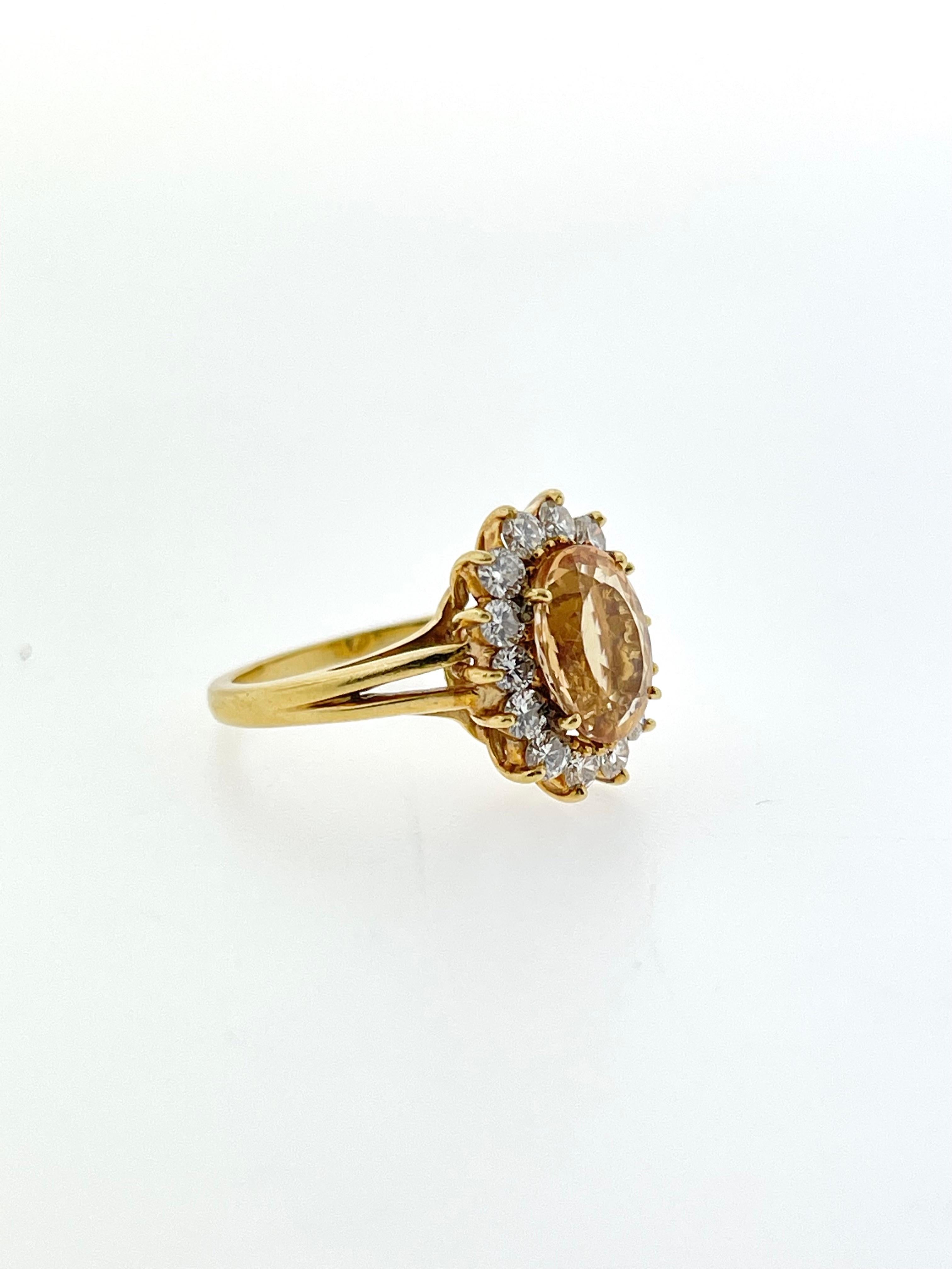 WOW! 

This ring is a one-of-a-kind but a oval imperial topaz center and fourteen bright round diamonds surrounding it! 

You don't want to miss out on owning this amazing ring!